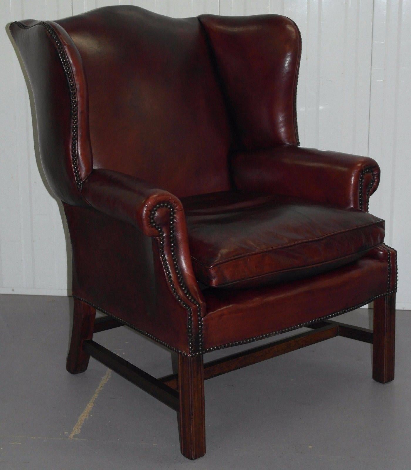 We are delighted to offer for sale this stunning handmade in Bath hand dyed aged oxblood leather wide Georgian wingback armchair

This armchair is part of a suite, we have one of these, a pair of footstools, a pair of leather oxblood wingback