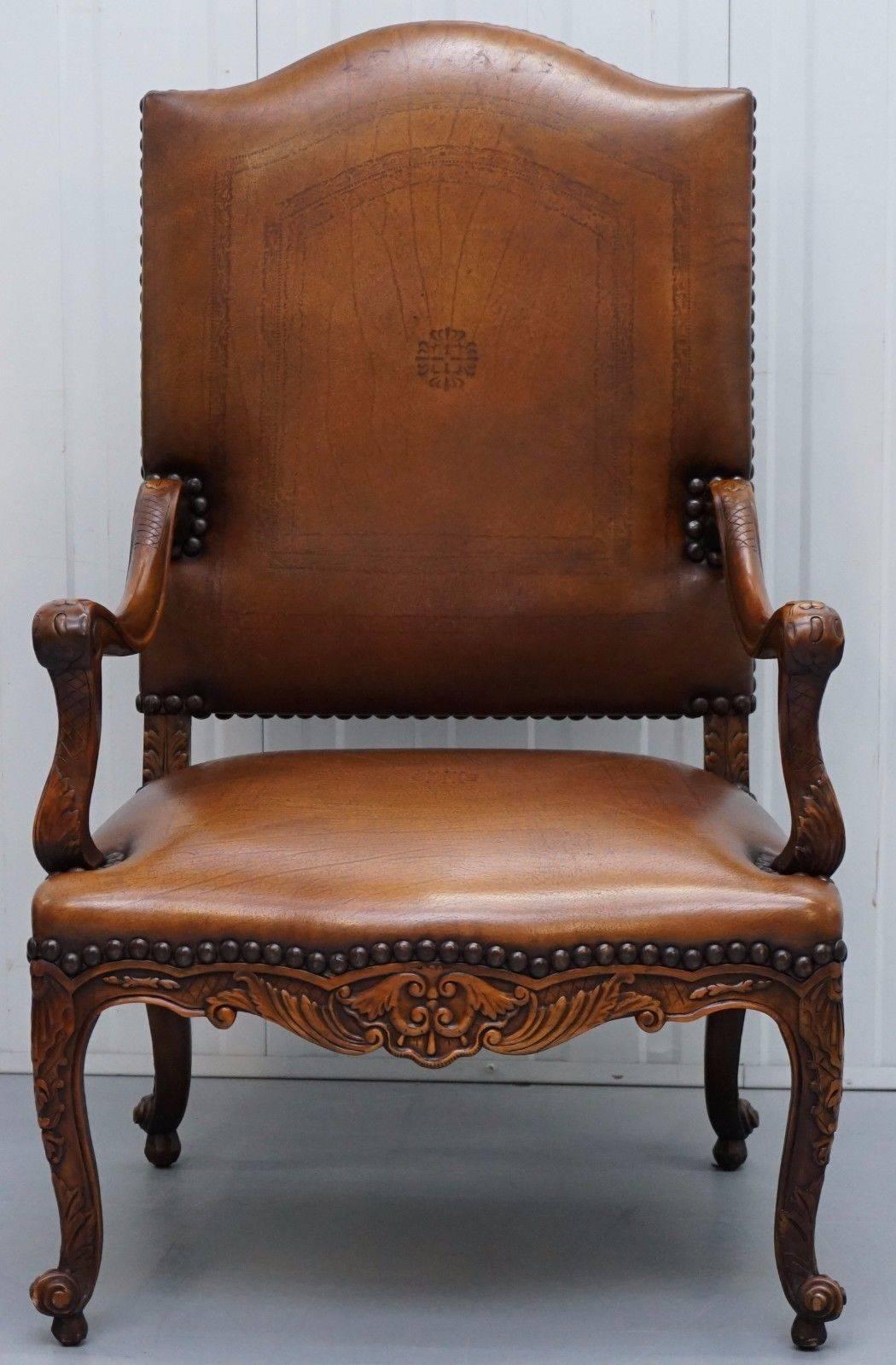 We are delighted to offer for sale this very large and grand Theodore Alexander high back aged brown leather embossed French Louis style throne armchair

A very comfortable and attractive armchair, handmade using carved arcadia wood and