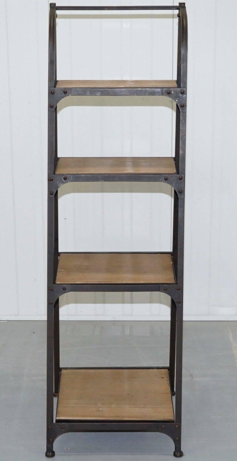 We are delighted to offer for sale this seriously cool industrial vintage set of bakers ladder shelves with solid steel frame

This is just about the most on-trend cool repurposed restored bookcase you will ever see, the iron frame and hand welded