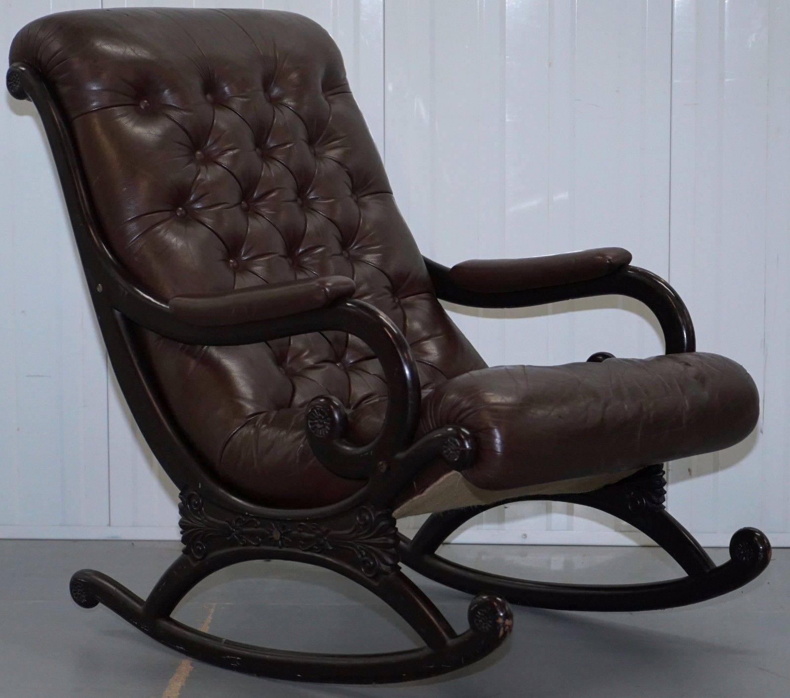 We are delighted to offer for sale this lovely vintage 1970's danish Chesterfield aged brown leather slipper rocking armchair

A well-used vintage piece in nice condition throughout, the leather has a lovely patina, the general look and feel of