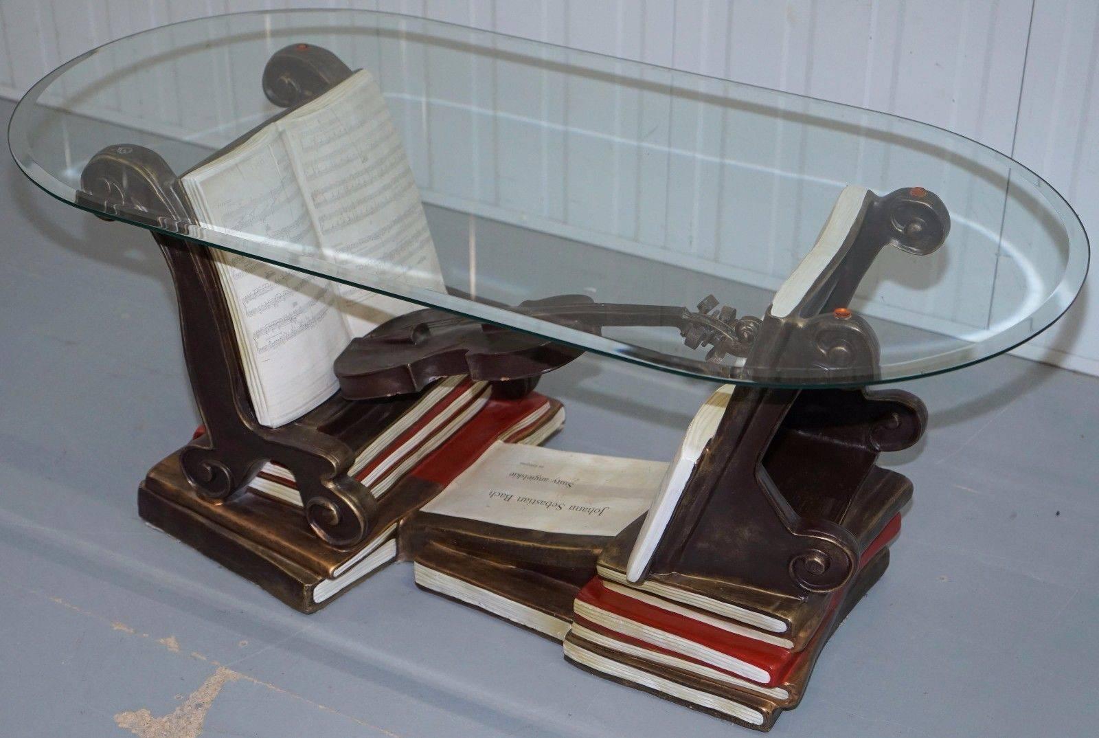 We are delighted to offer for sale this very rare Johann Sebastian Bach glass topped musical themed coffee table

A really splendid thing, the glass top is very tick and nicely tapered around the trim, the base frame is that of stacks of music