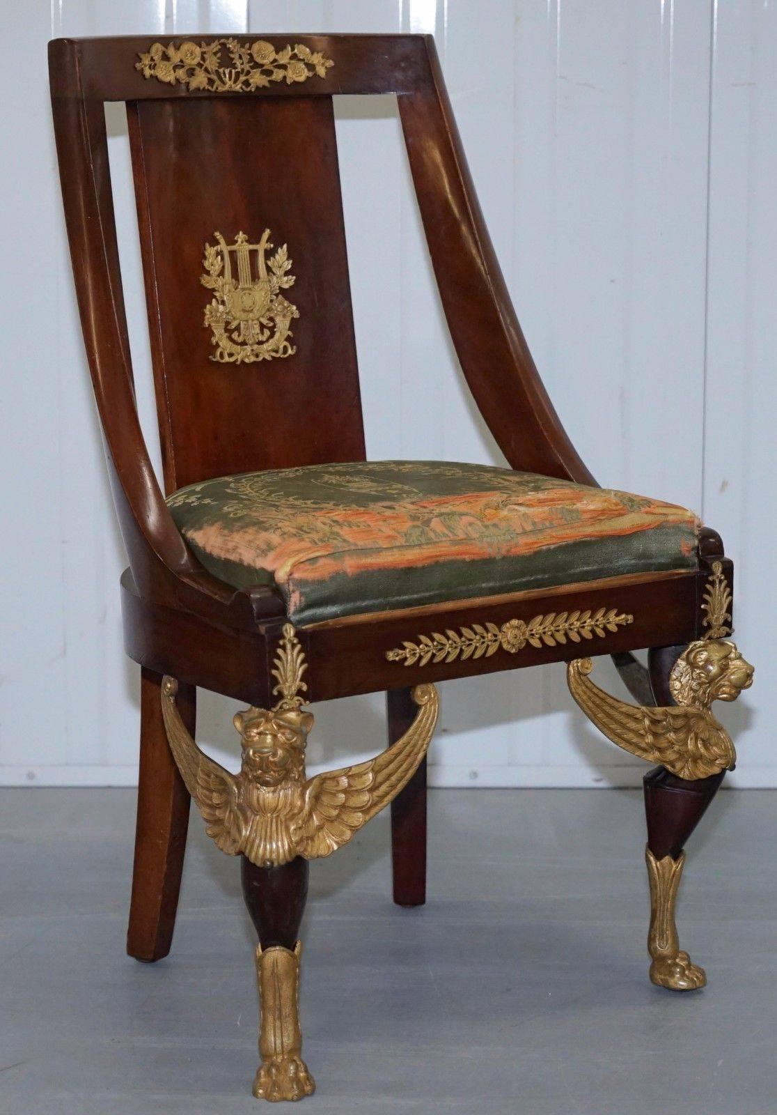 We are delighted to offer for sale this lovely pair of period Second Empire Sleigh back circa 1852 French mahogany chairs with gold ormolu Lion legs and original upholstery

A really rare pair in very desirable condition throughout, the upholstery