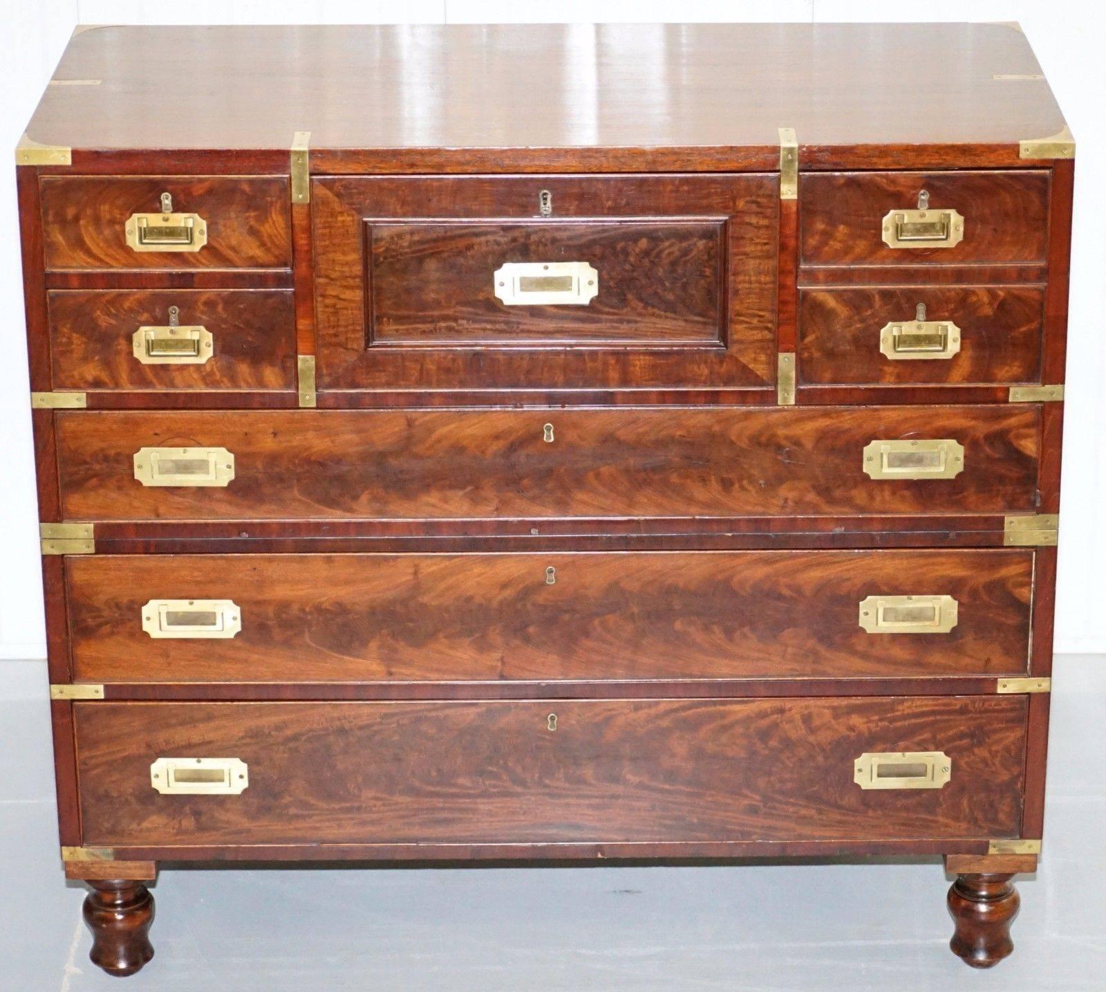 We are delighted to offer for sale this stunning original, circa 1890, flamed Military campaign chest with drop front Secretaire desk.

A very large and well-made piece in stunning lightly restored condition, this chest would have been at the top