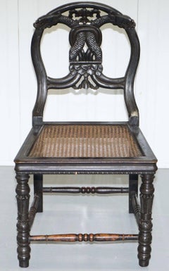 Set of Four 19th Century Ebonized and Carved Wood Chinese Dragon Dining Chairs