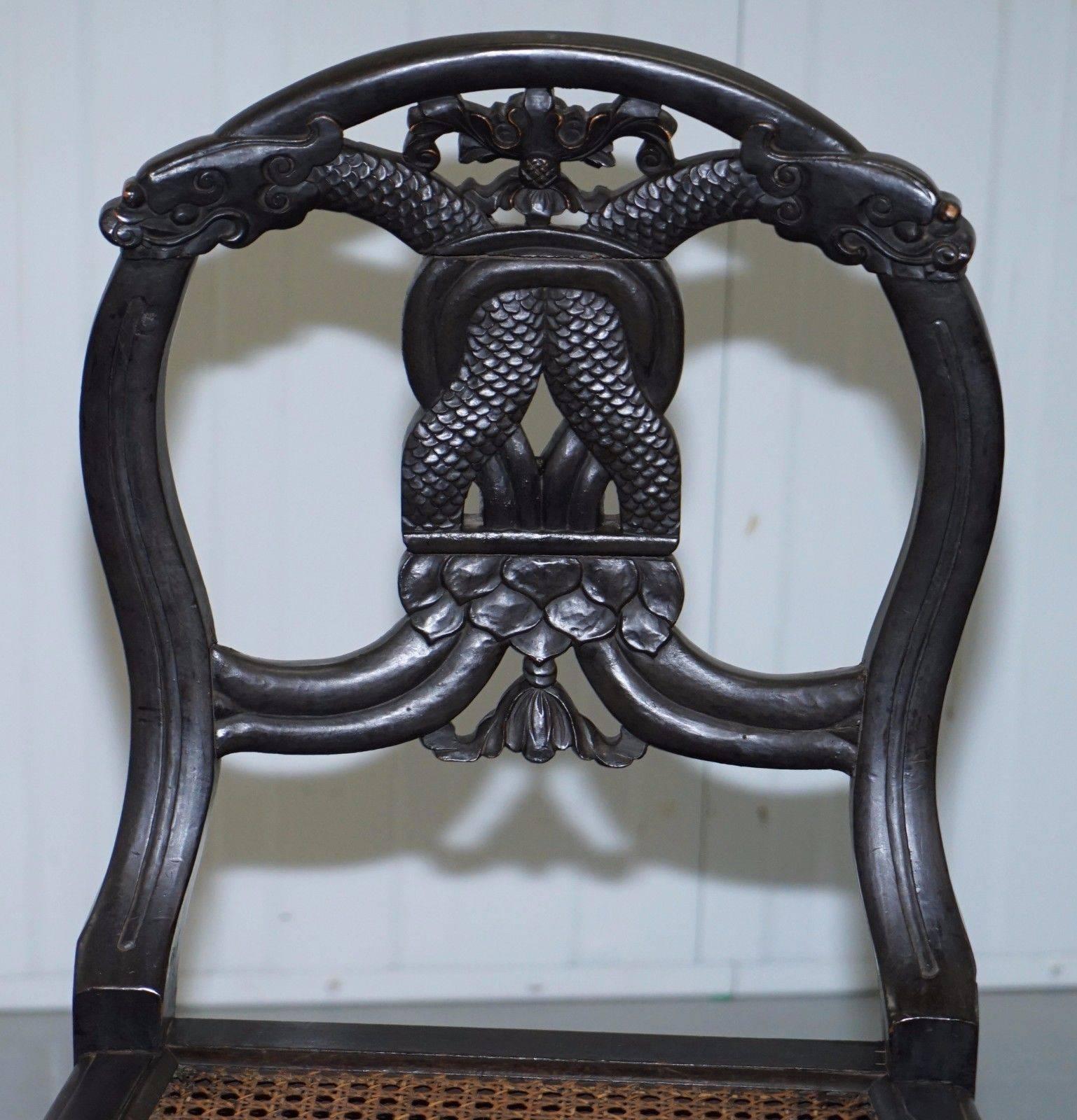 Chinese Export Set of Four 19th Century Ebonized and Carved Wood Chinese Dragon Dining Chairs