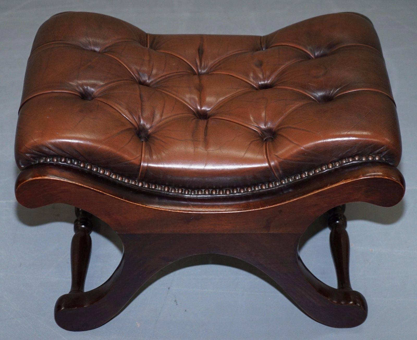Pair of 1960s Aged Brown Leather Chesterfield Wingback Armchairs and Footstool 1