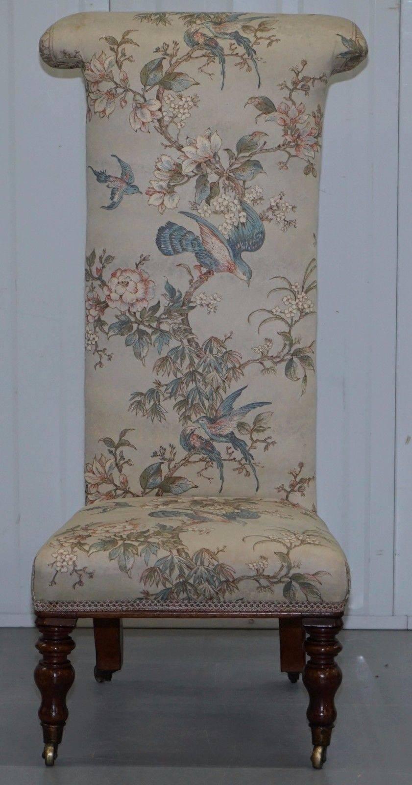 We are delighted to offer for sale this lovely Victorian Prayer chair with a mahogany frame and silk floral and bird detailed upholstery, part of a four piece suite

As mentioned this is part of a suite, I have this chair, then a larger Library