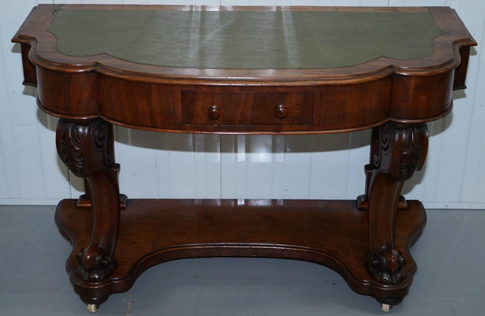 We are delighted to offer for sale this stunning Victorian mahogany scroll carved leg console writing table with original castors

A lovely piece is in stunning condition, the patina of the wood is to die for as are the lovely expertly carved