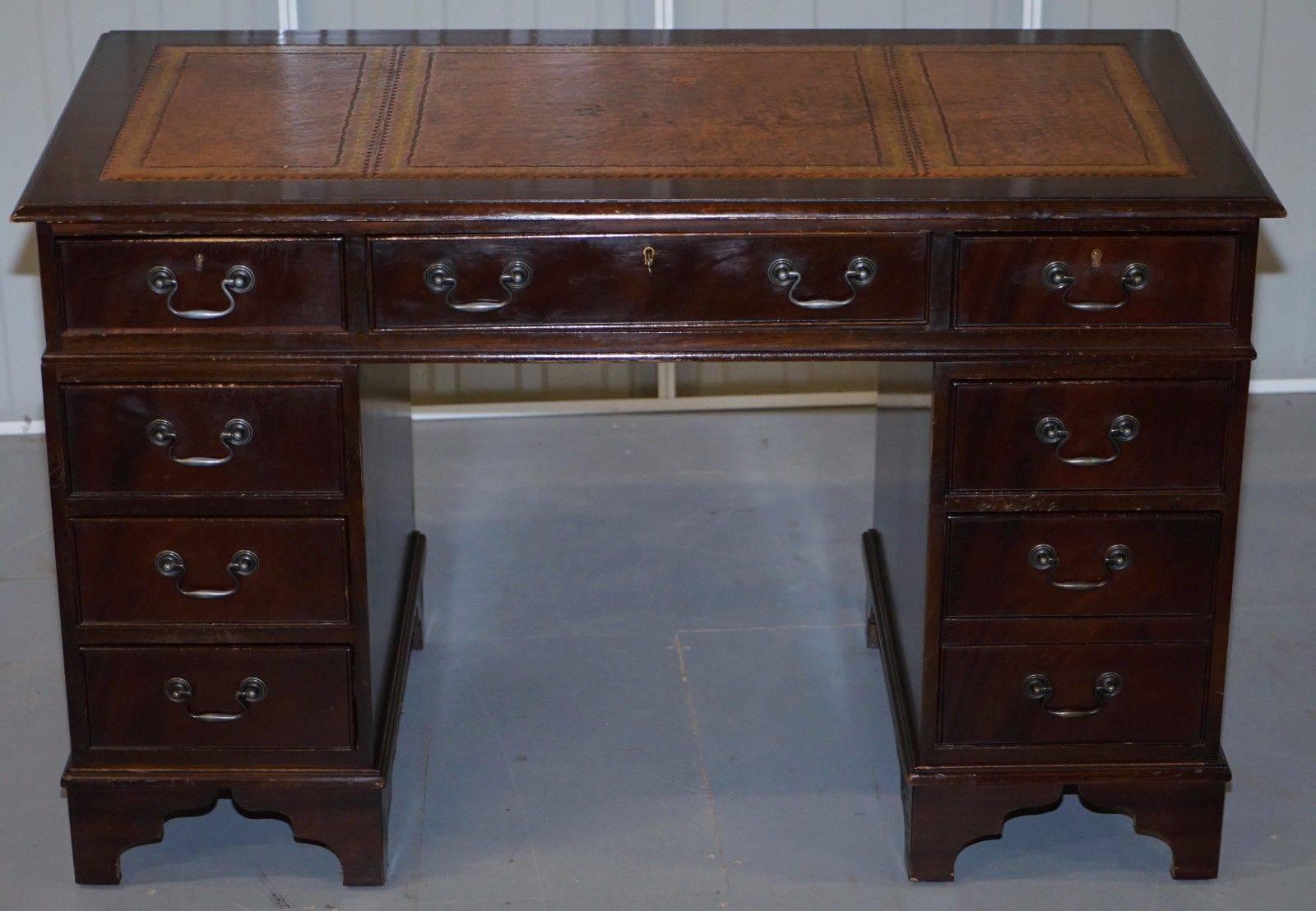 We are delighted to offer for sale this premium twin pedestal partner desk with luxury medium brown gold inlaid leather writing surface

There are many variations of these desks starting with basic soft wood, there are around six levels from the