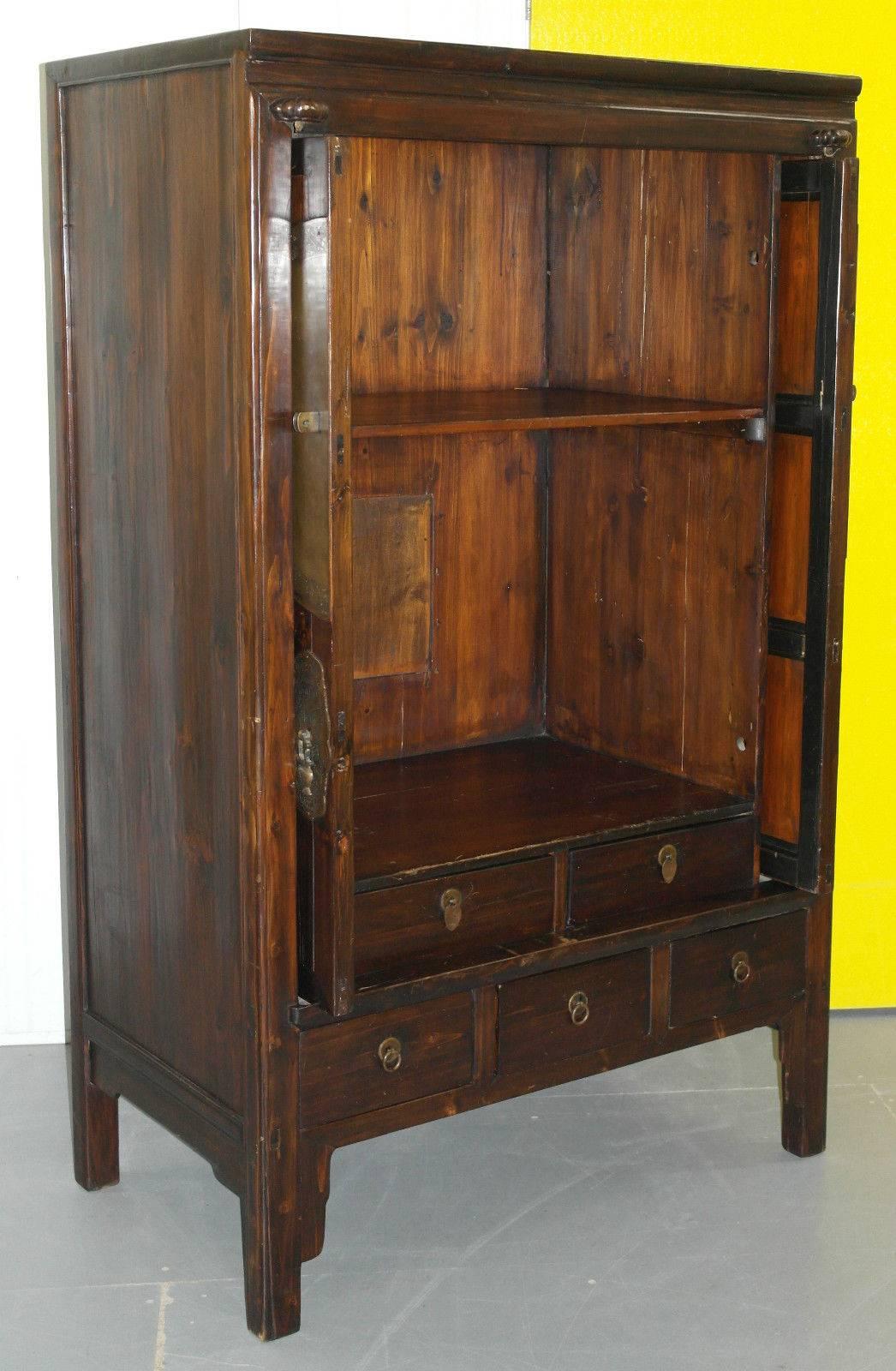 We are delighted to offer for sale this stunning Chinese Ming style entertainment unit made from solid elmwood with retractable doors

The basic model in this range costs £1350 without the retractable doors or internal drawers, this model is just