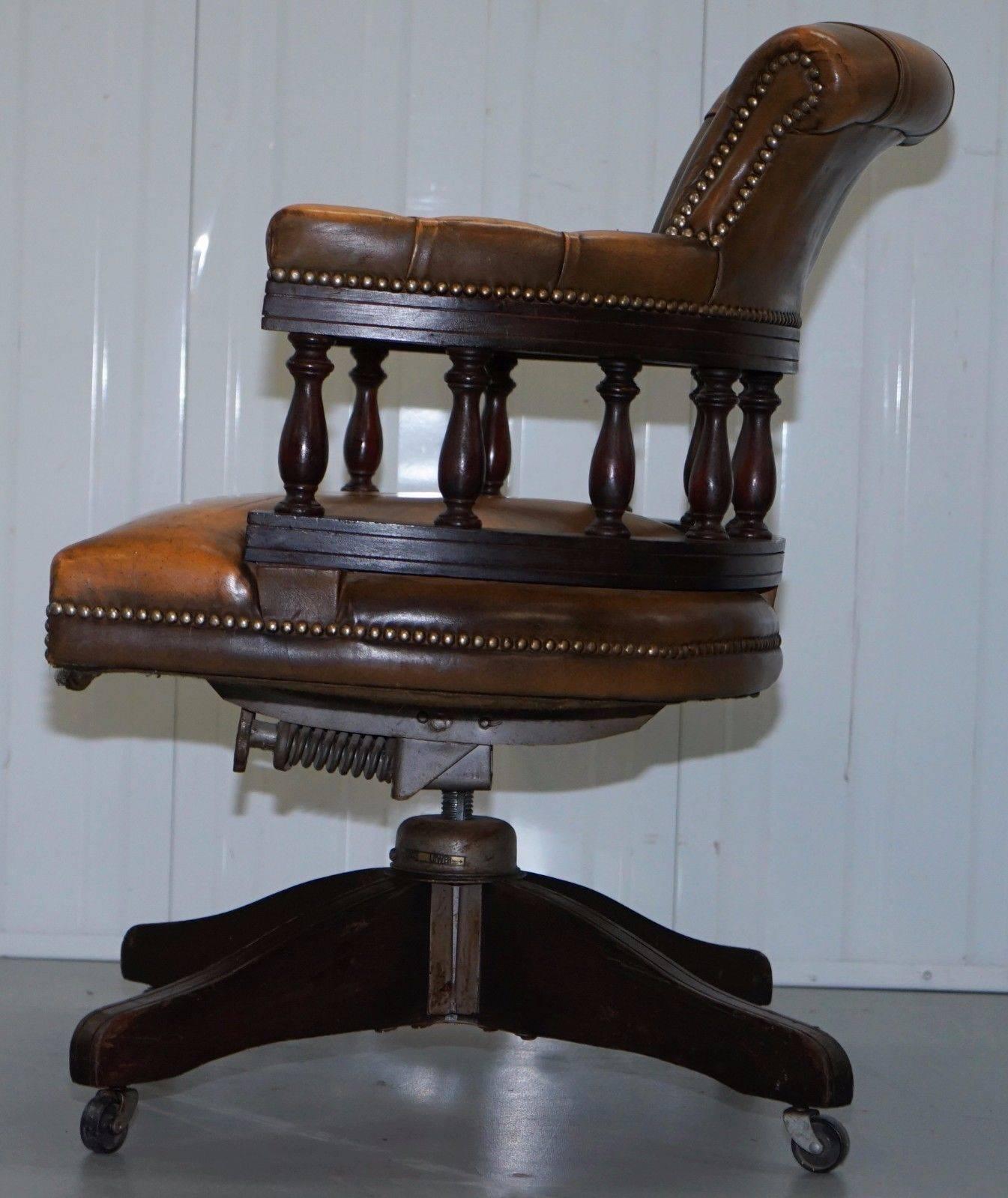 We are delighted to offer for sale this lovely 1950s original Chesterfield aged tan brown leather captain’s chair

The chair was made by the original Chesterfield Company, circa 1950, back then they were using Hillcrest bases which are the finest