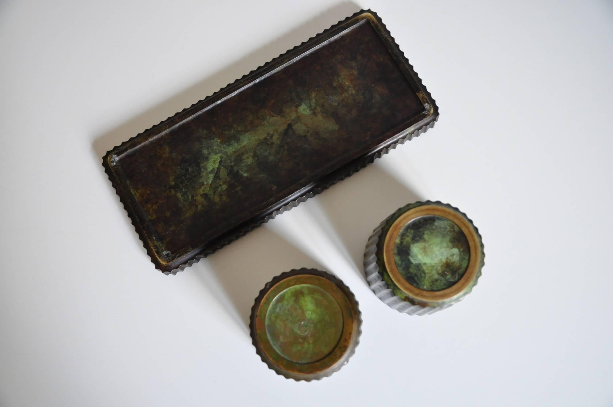 Two Art Deco bronze bowls/vases and one tray by Argentor, Denmark. 
Vases diameter 9cm, height 8cm
Tray 27 x 12 x 2cm
With nice patina.