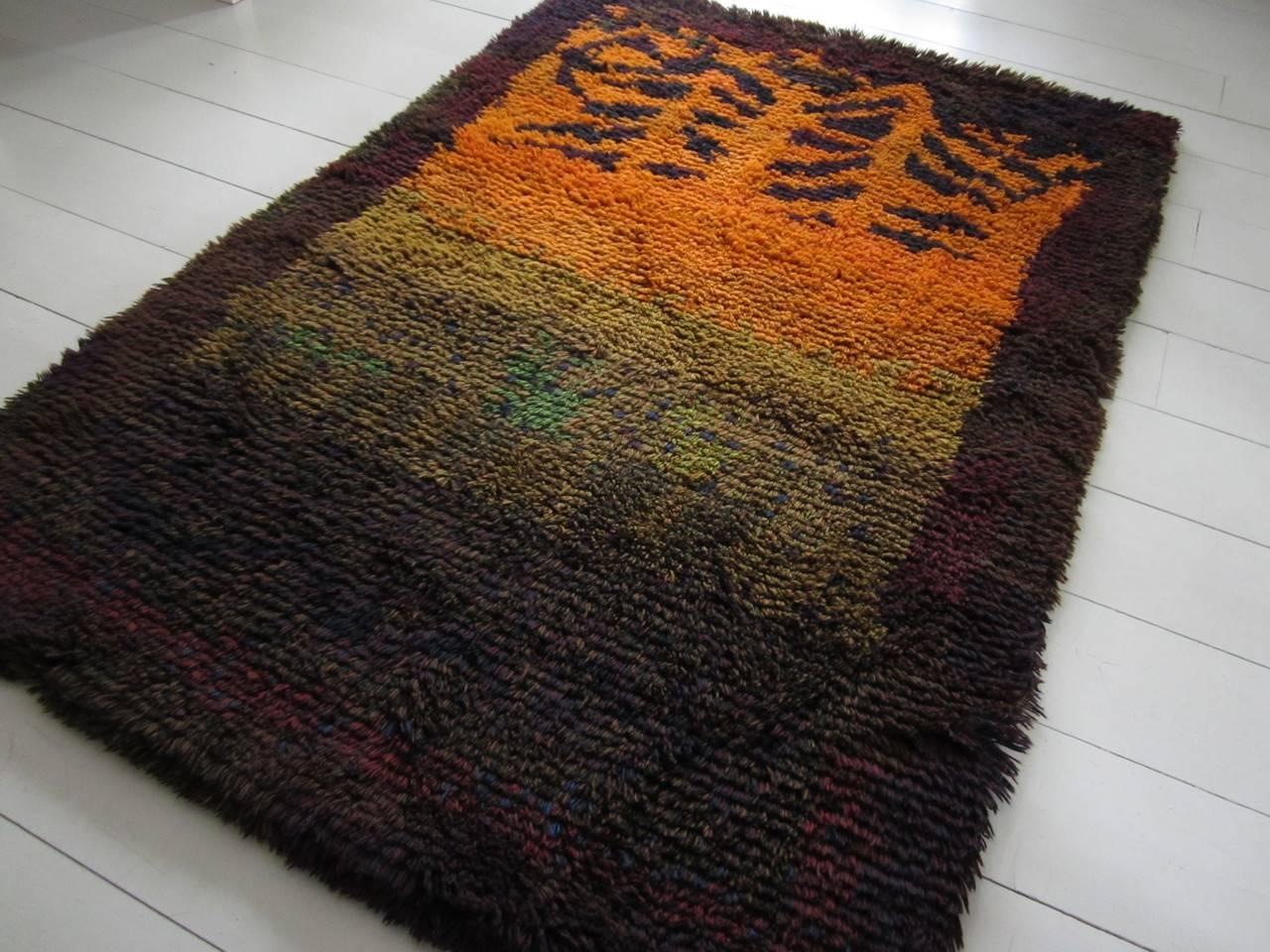 A rare Rya rug from a Finnish textile designer Ritva Puotila, Auringonlasku (Sunset). Designed in 1963 for Friends of Finnish Handicrafts, the leading rug house in Finland.

Friends of Handicrafts was the company, which hired the top designers,