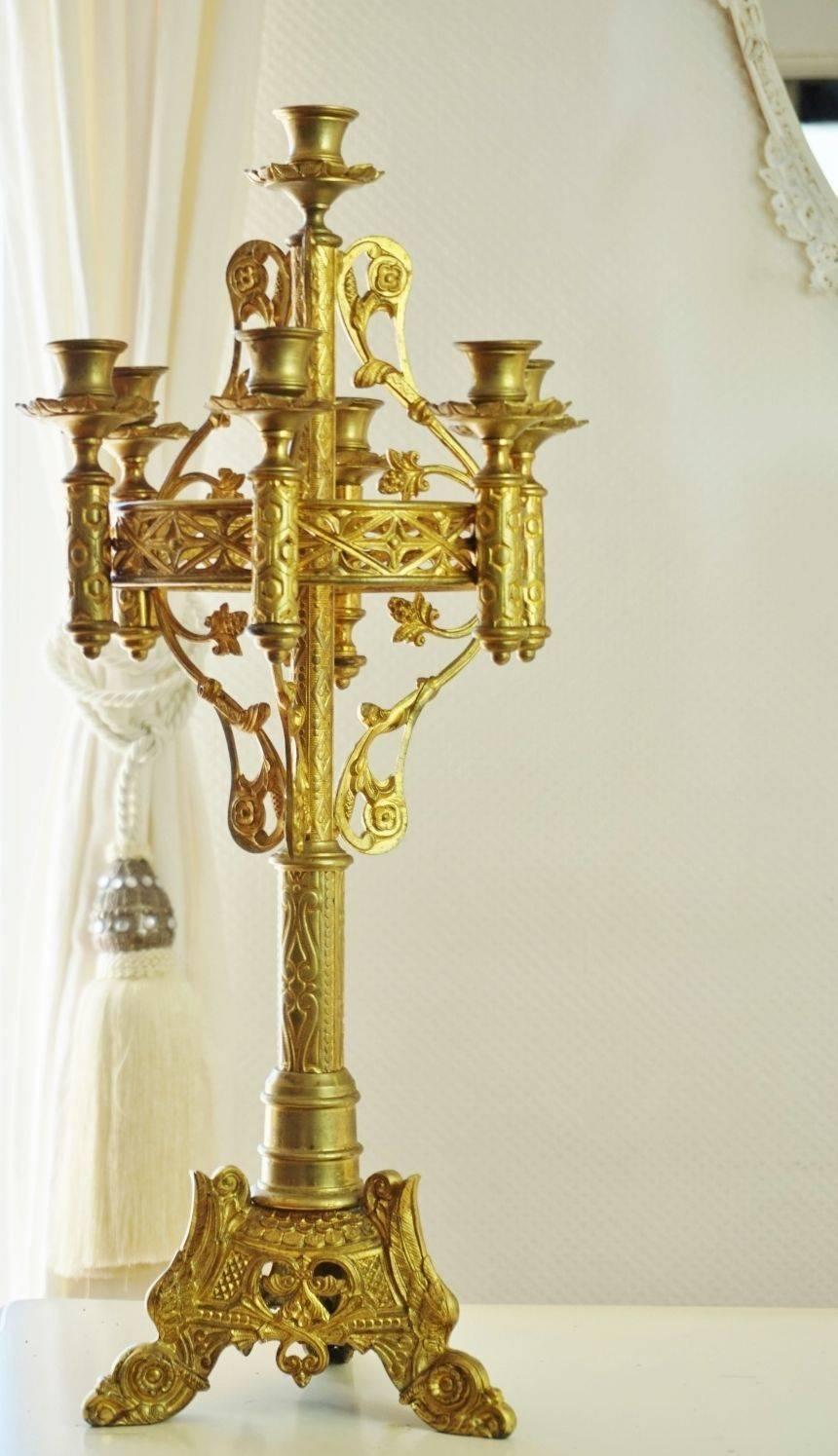 Large and heavy 19th century Gothic church candelabra.
Gilt bronze and old brass with very detailing ornaments in high
quality casting, with seven candle holders on a circular open ornate bracket.

Dimensions:
Height: 25 in (63.5 cm)
Diameter: