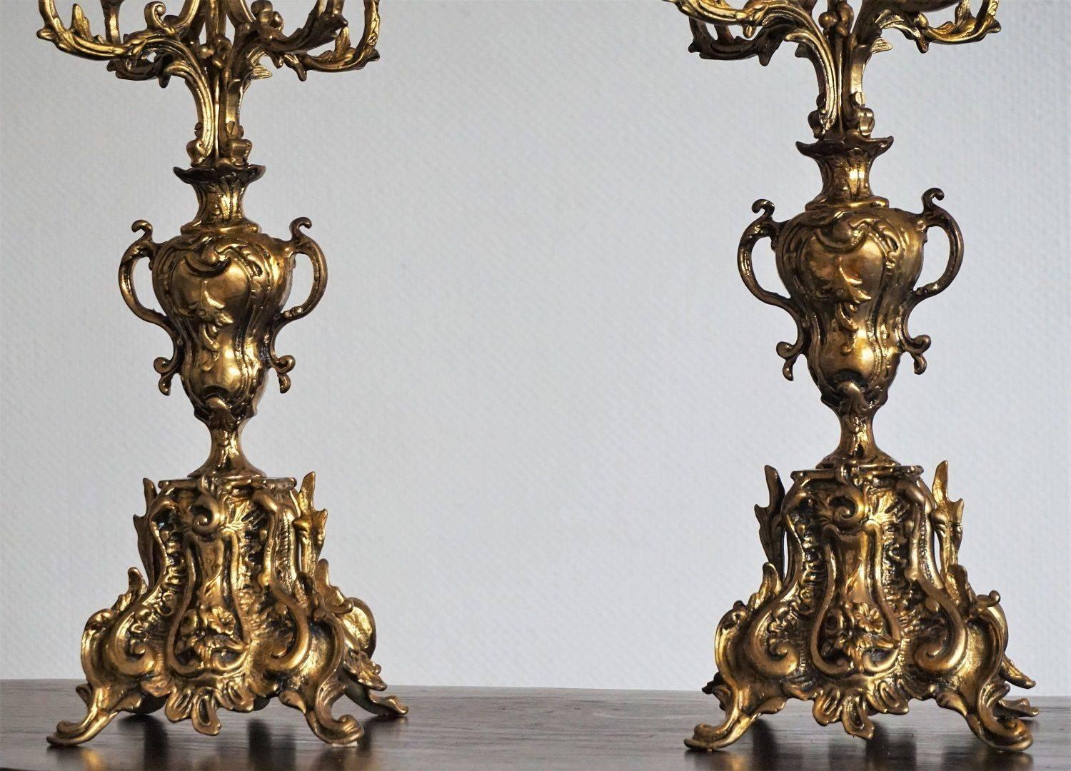 Pair of large and heavy Art Nouveau bronze five-light candelabra richly ornate, circa 1890-1900.

Dimensions:
Height: 19 1/2 in (49 cm)
Width/depth: 8 in ( 21 cm)
Base: 6 1/4 in X 5 1/8 in (16 cm x 13 cm)
Weight: 8 lb. each candelabra (4 kg).