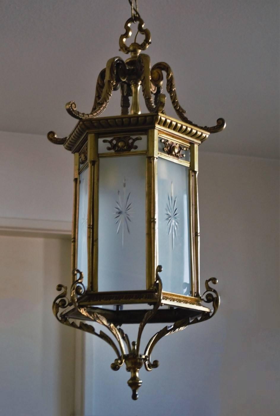 Heavy, large Recency syle thee-light lantern, France circa 1870 - 1880. This lantern is of solid bronze and parcel brass with six frosted cut glass windows. The lantern arrives with beautiful solid bronze canopy and chain. 
Number of lights: Three