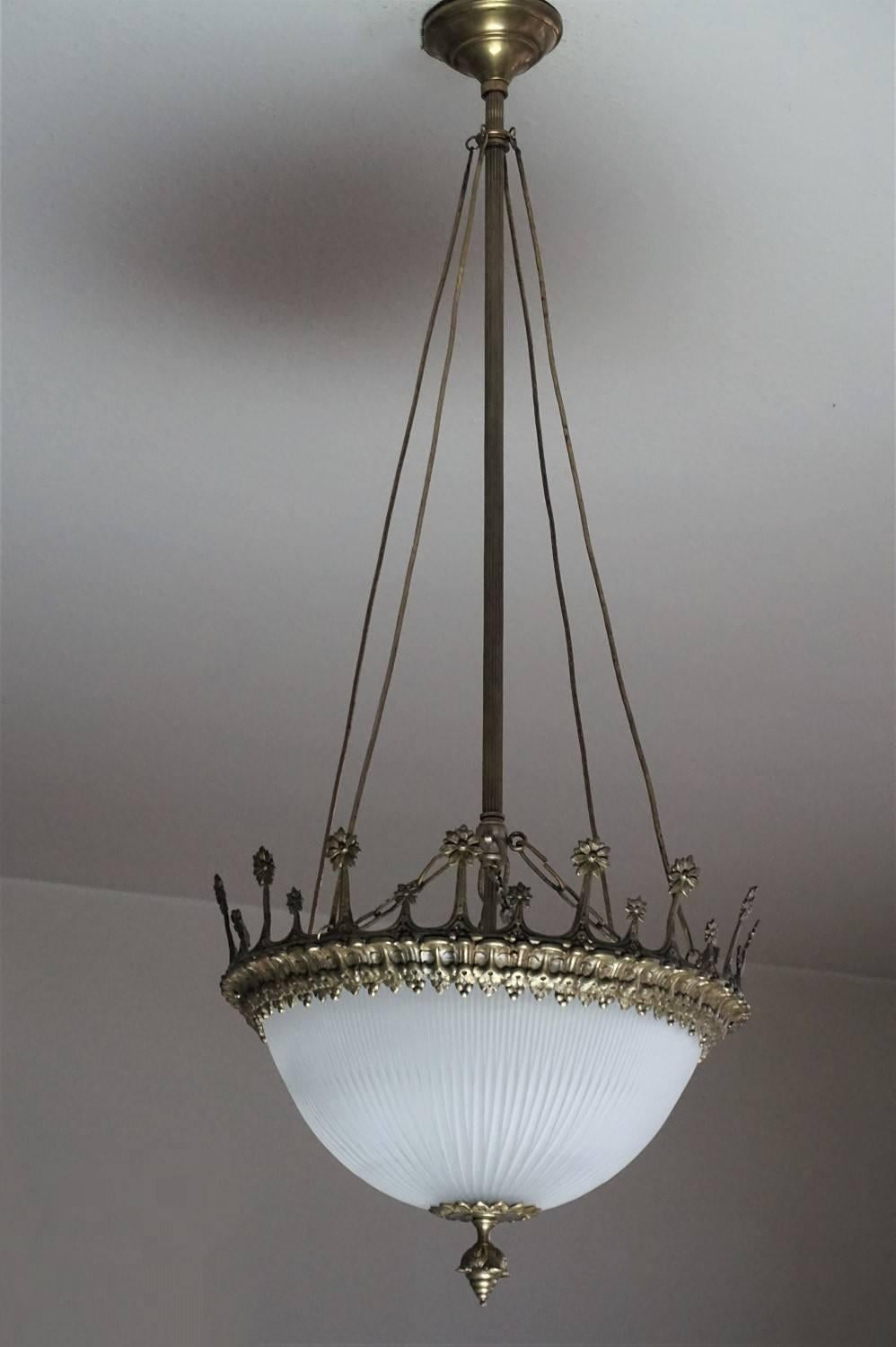 Spanish Art Deco crown shaped patinated bronze and frosted cut-glass two-light chandelier/lantern with bronze hanging four branch, circa 1920 - 1930

Two large bulb sockets 
Measures:
Height: 41 in (104 cm)
Diameter: 16.25 in (41 cm).

 