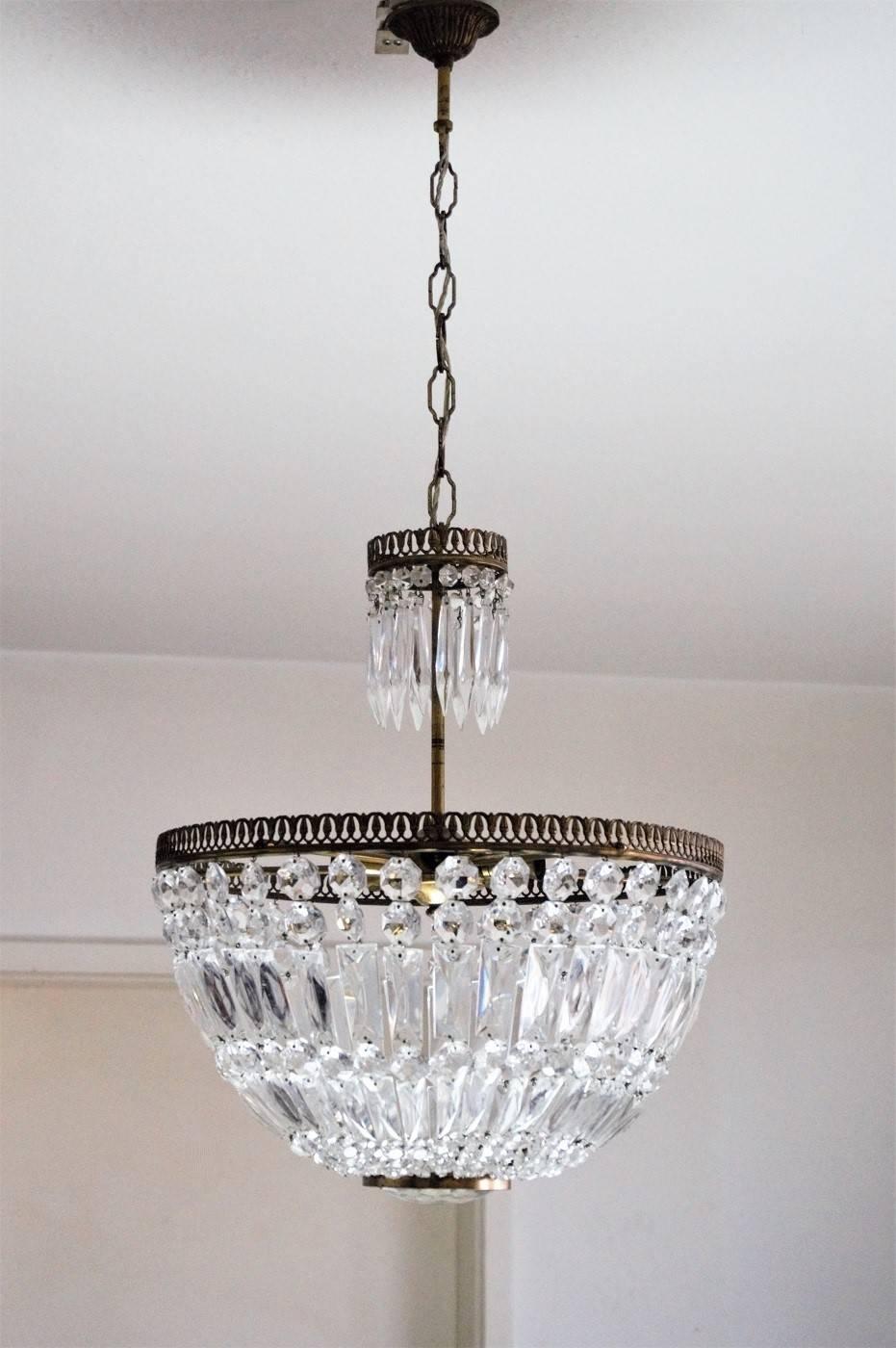 French cut crystal and brass corbeille/basket Style chandelier, circa 1930 
Number of lights: Five E14 bulb sockets. Rewired and ready to hang.
Measures: 
Total height 34 in / 86 cm (can be extended or reduced at the hanging chain)
Height without
