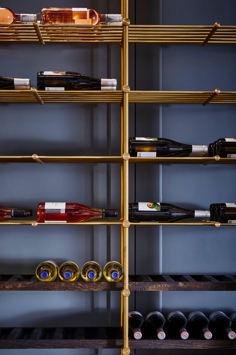 Brass Wine Room with Brass Framed Glass Doors and Pulls and Brass Wine
