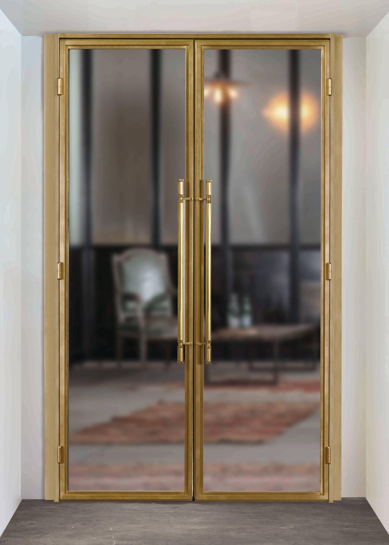 Clean Modern Bronze Doors with Machined Bronze Door Pulls and Hinges