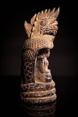 Lacquered and Gilded Wood Buddha Seated in a Naga Shrine