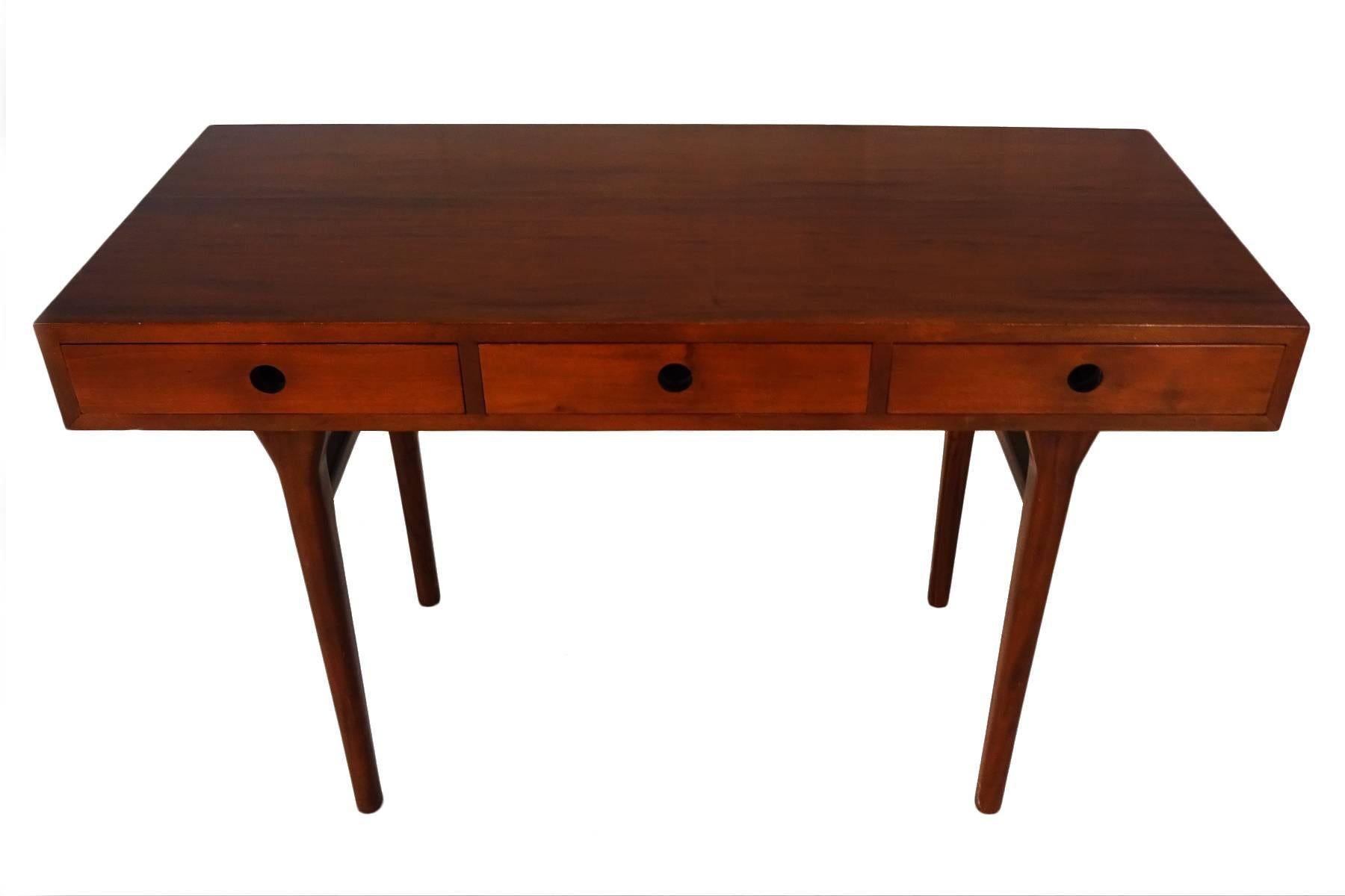 Best known for his ‘Smile’ table Anderson was an accomplished cabinet maker who produced numerous designs including seating, tables and storage from his own workshop and for other furniture manufacturers from the 1930s up until the mid-980s when he