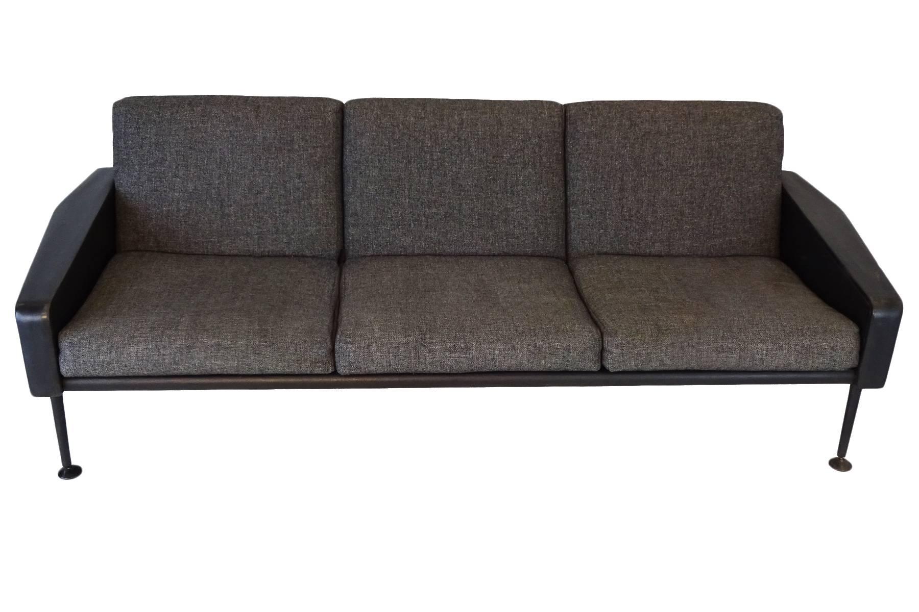 Ernest Race sofa in black leather and grey Irish tweed fabric that is excellent vintage condition save a few small scuffs to the leather here and there. The design dates back to the late 1950s and this sofa was produced in 1965. Apparently this was