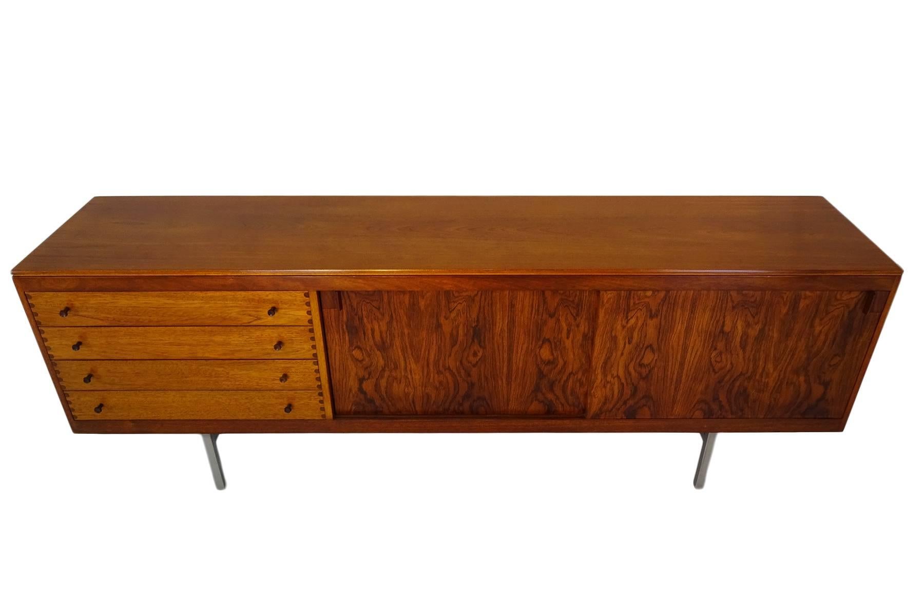 Robert Heritage is celebrated as the most awarded designer in the history of the British Design Council with numerous designs to his name including furniture, lighting, and accessories. However, he is best known for his range of sideboards/credenzas