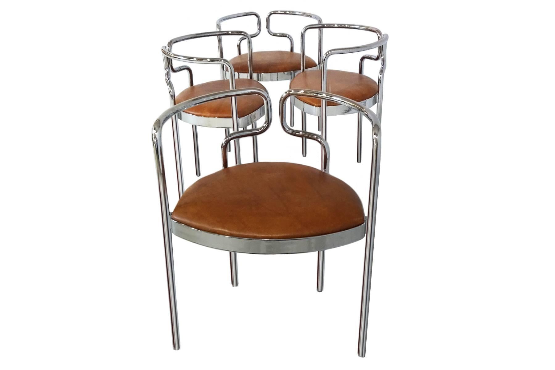 A set of four rare dining or armchairs, model 9230, by Danish architect and designer Henning Larsen. Originally designed by Larsen in the late 1960s for the Kar Cafe in Copenhagen in 1967 they are constructed of bent chrome-plated steel, ply wood