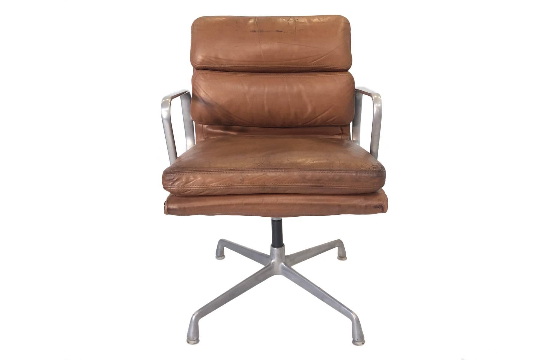 A design Classic, this Eames soft pad chair has certainly seen some action! The natural wear to this item will either delight or distress you depending on your ethos on vintage pieces. Many collectors like to see honest wear on their items and