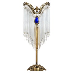 Ancienne lampe de table Art nouveau inspirée d'Hector Guimard, avec cabochon en verre bleu
