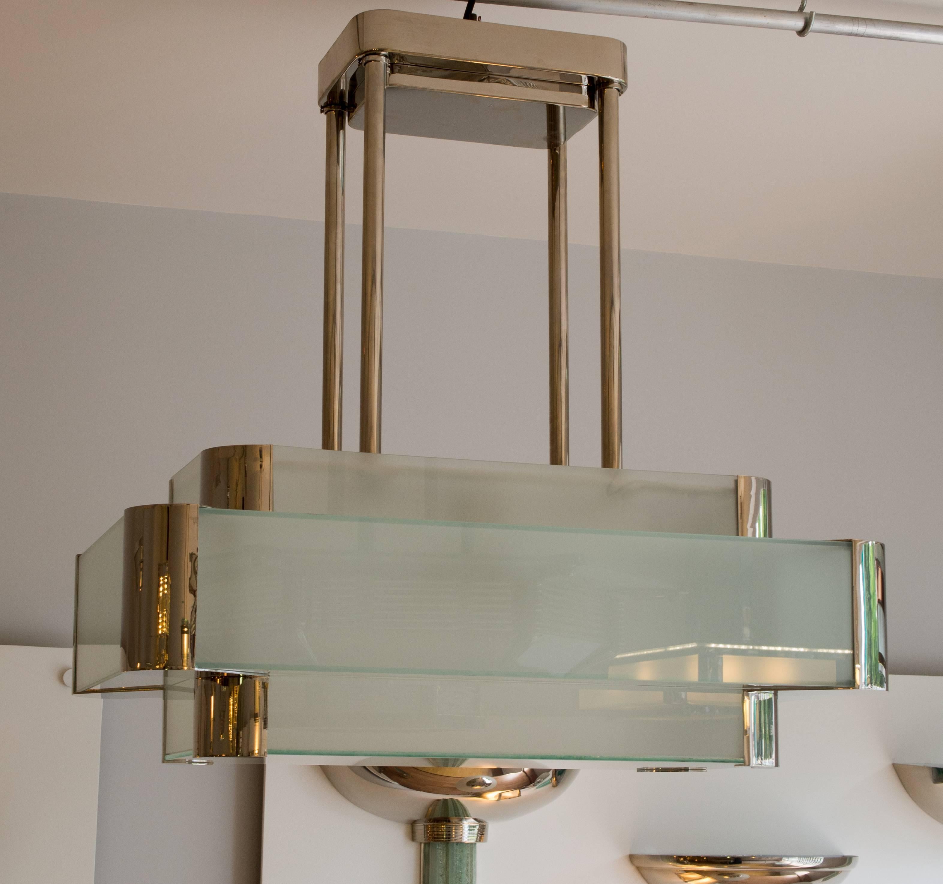 Art Deco chandelier with brass nickel finish and glasses.