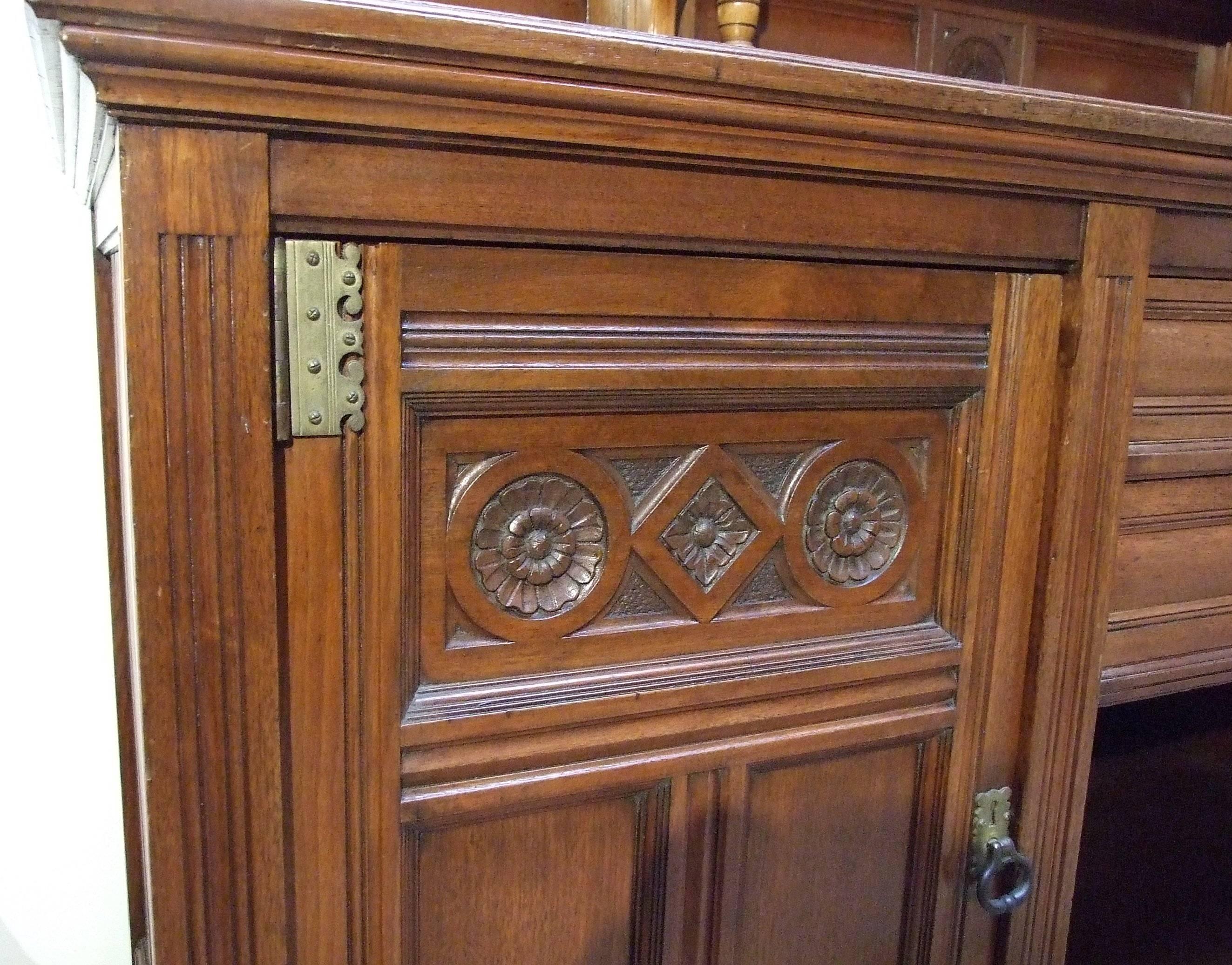 A walnut Aesthetic sideboard, the design attributed to Bruce Talbert, made by Gillows of Lancaster (stamped), circa 1875. Measures: 191cm (75in) high, 191cm (75in) wide, 61cm (24in) deep.