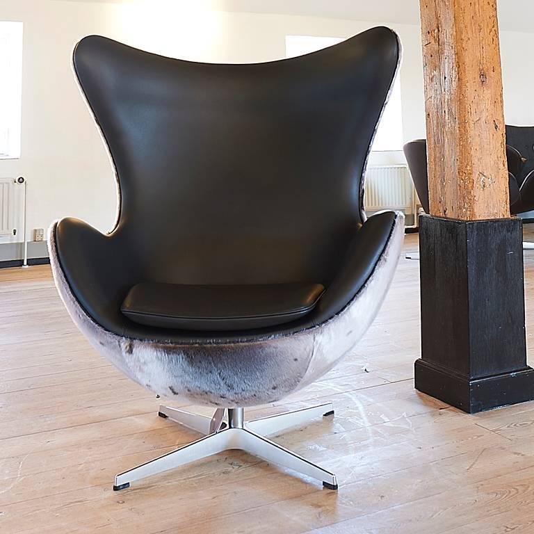 New Egg chairs by Arne Jacobsen made special with black elegance leather on the inside and seal fur on the back.