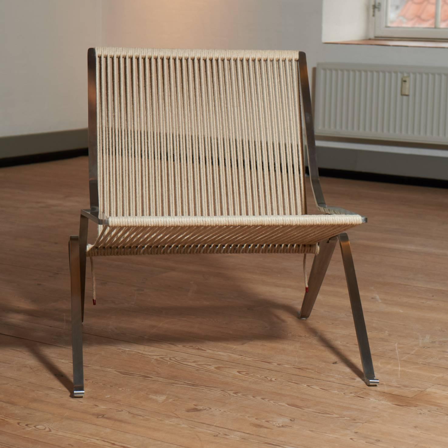 A beautiful example of Poul Kjaerholms PK25 armchair in steel and papercord.
The chair is from the late 1990s, but do not have any signs of use.