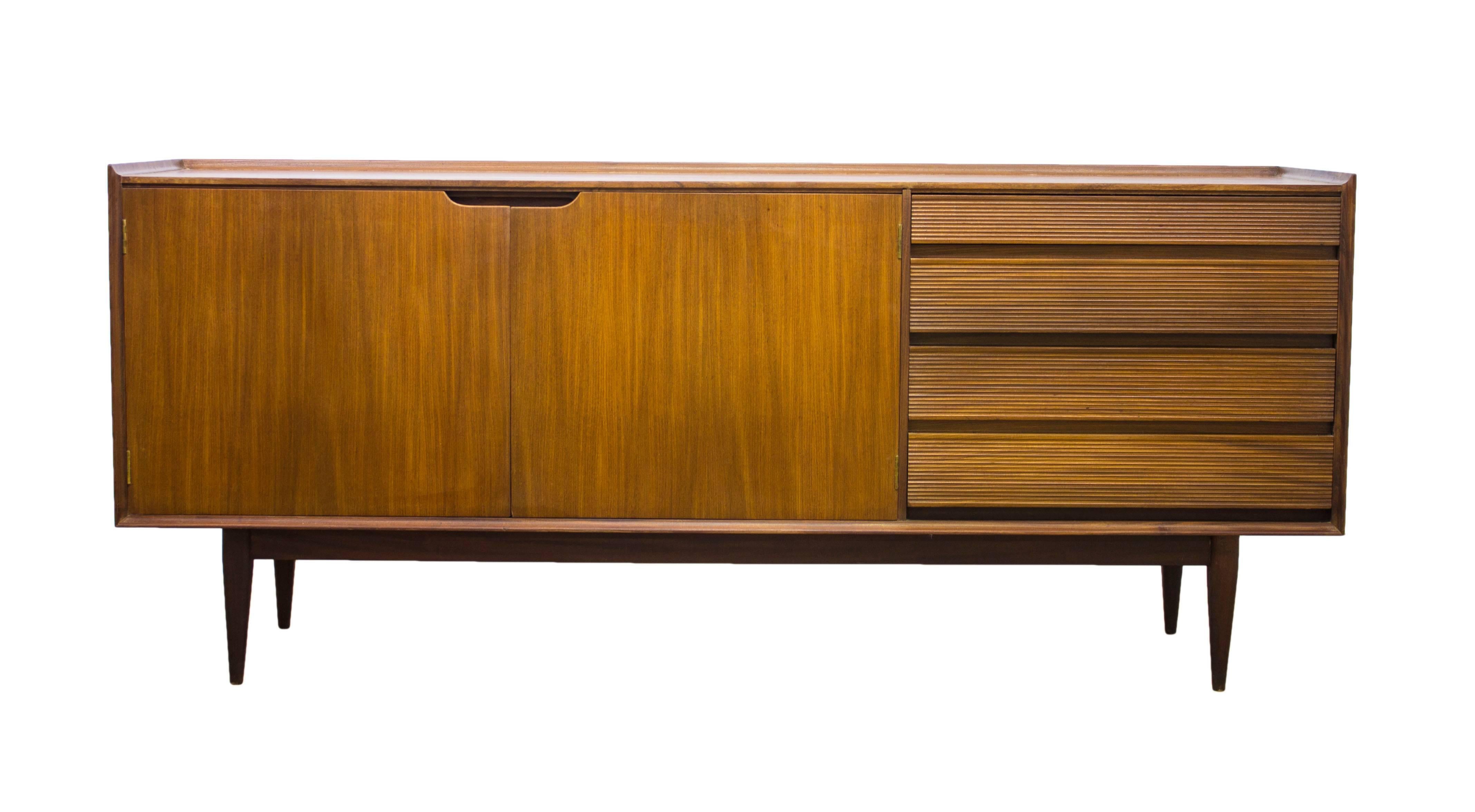 Designing for Fine Lady Furniture, Richard Hornby shot to fame during the mid century period with his stunning designs which graced the halls of Heals quickly becoming much sought after and inspirational, aspirational pieces.

In rich Afromosia,