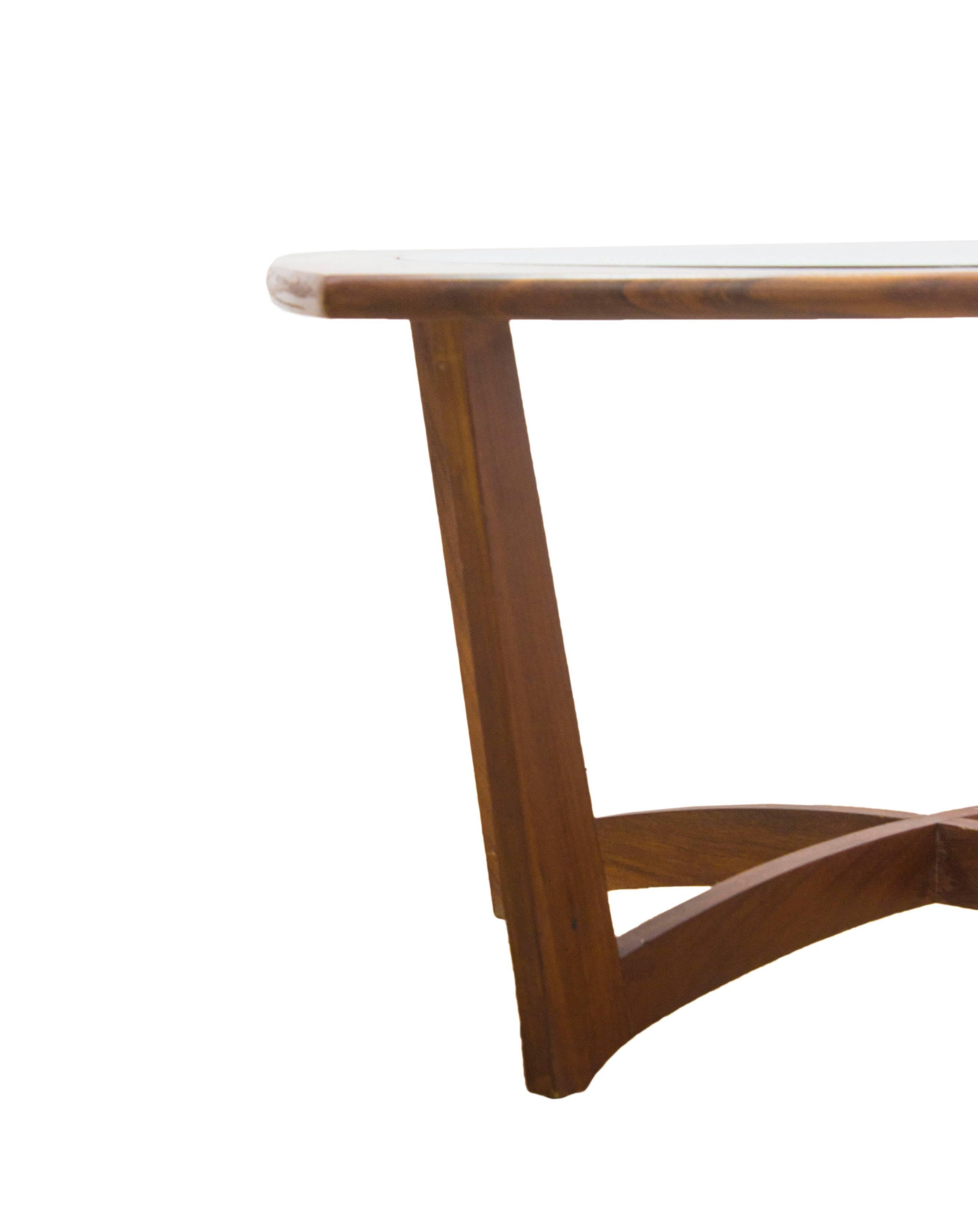 Danish design has always been at the forefront of the Mid Century Movement and its not hard to see why when designs such as this beautiful compact Teak and glass table come to light!

With it’s ample surface perfect for anything from a cup of tea