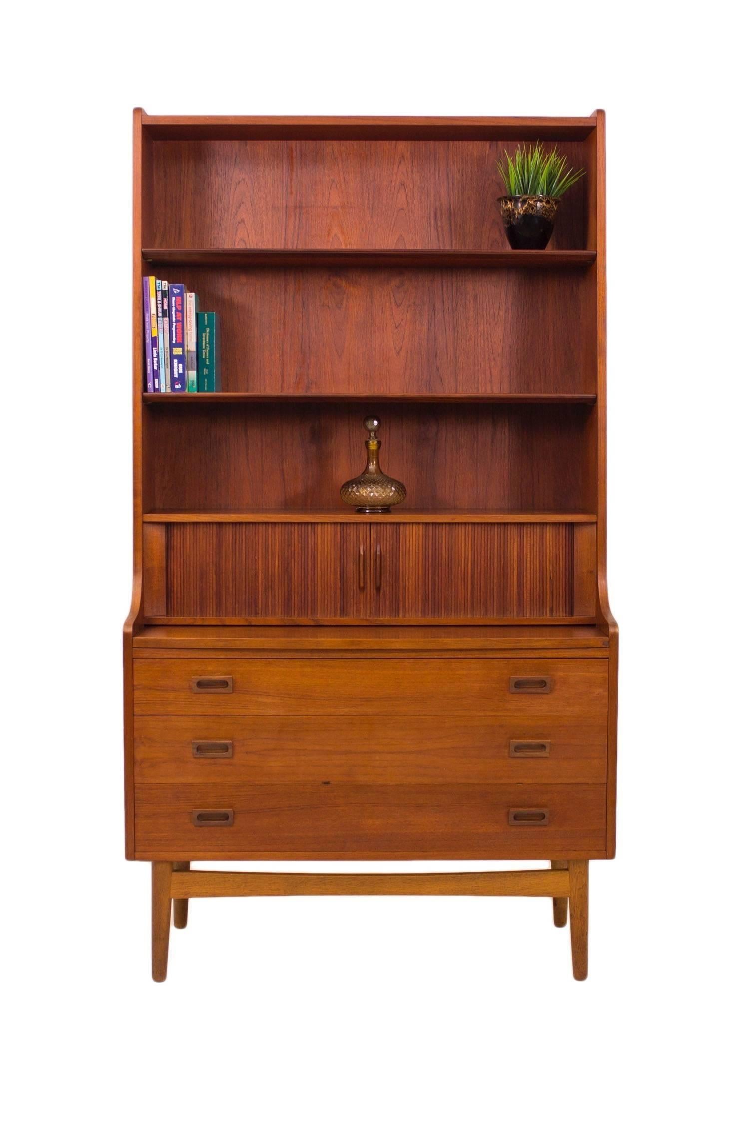 Bornholm Mobler led the way in bringing Danish Mid-Century designs to the world in innovative and functional ways.

This stunning Bureau shelving unit in beautiful rich teak is a fantastic multi functional unit offering not only ample storage in