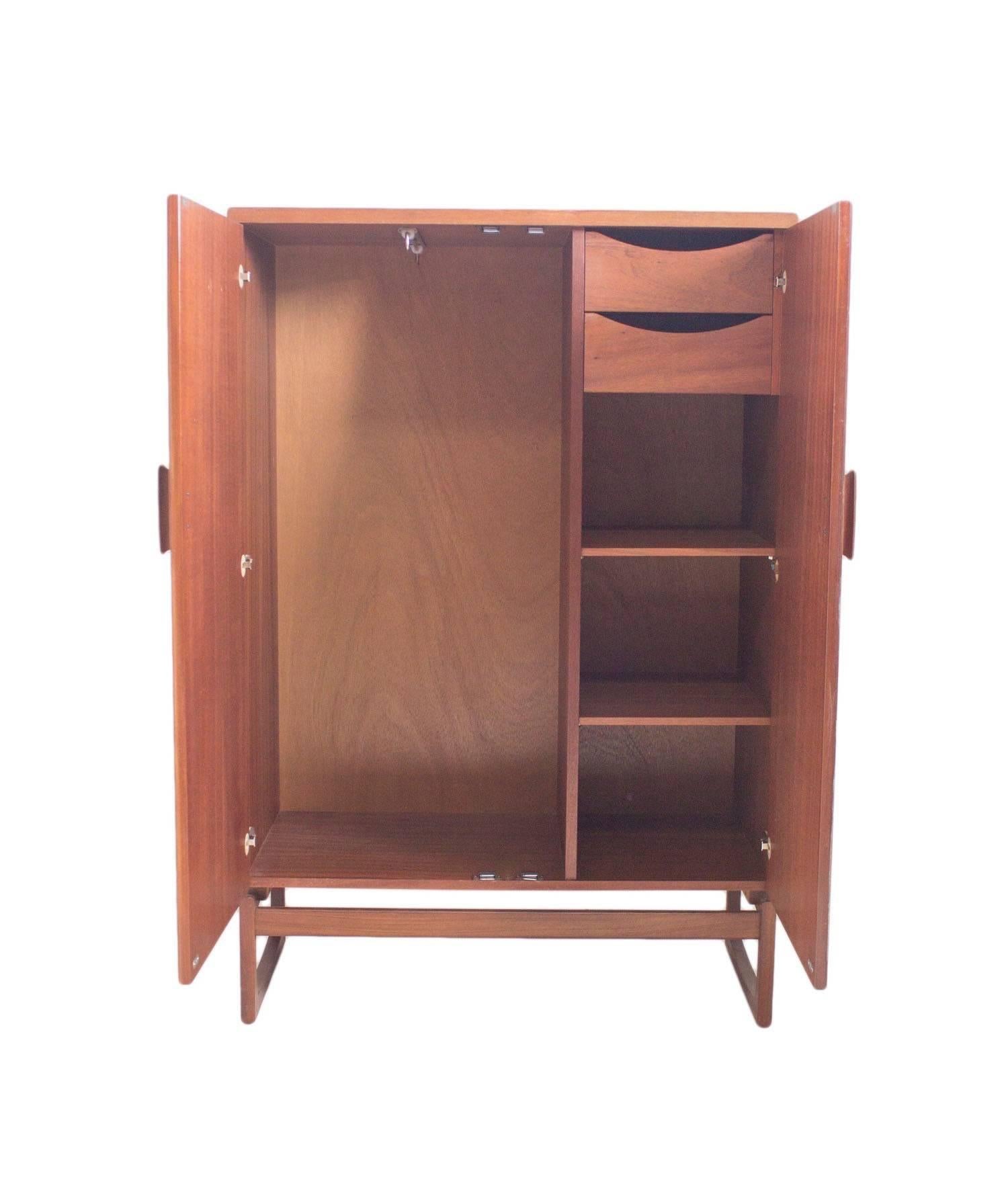 1965 could be argued as one of the best years for G Plan design with R Bennett creating the stunning Quadrille range of furniture in luxurious teak with beautiful rosewood handles.

This extremely rare and highly sought after Tallboy Wardrobe unit