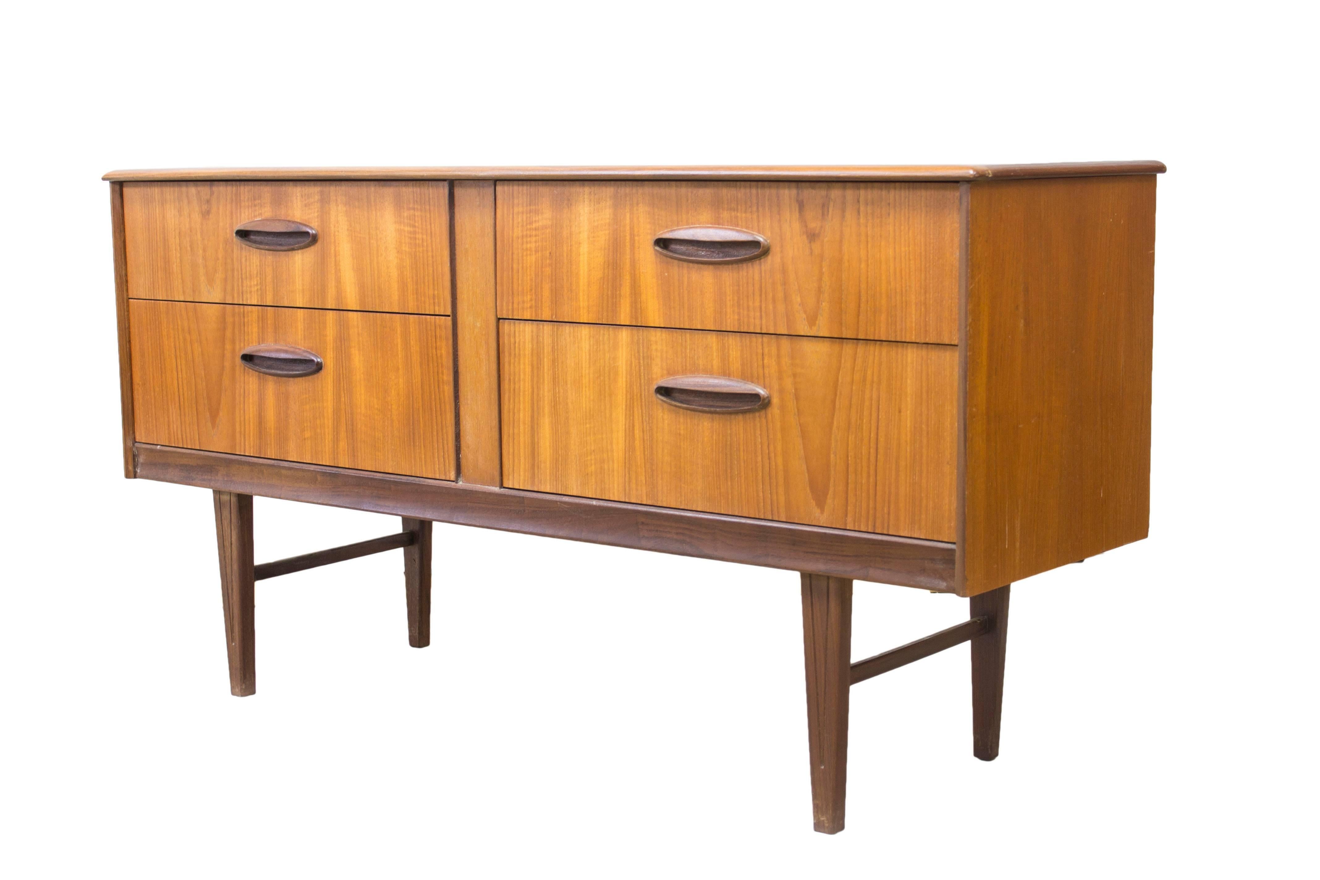 The Danish designers of the Mid-Century movement brought clean, simple lines to the masses and introduced the world to the wonders of teak in it’s many guises, stunning grain and rich colors.

This beautifully compact unit with it’s four ample