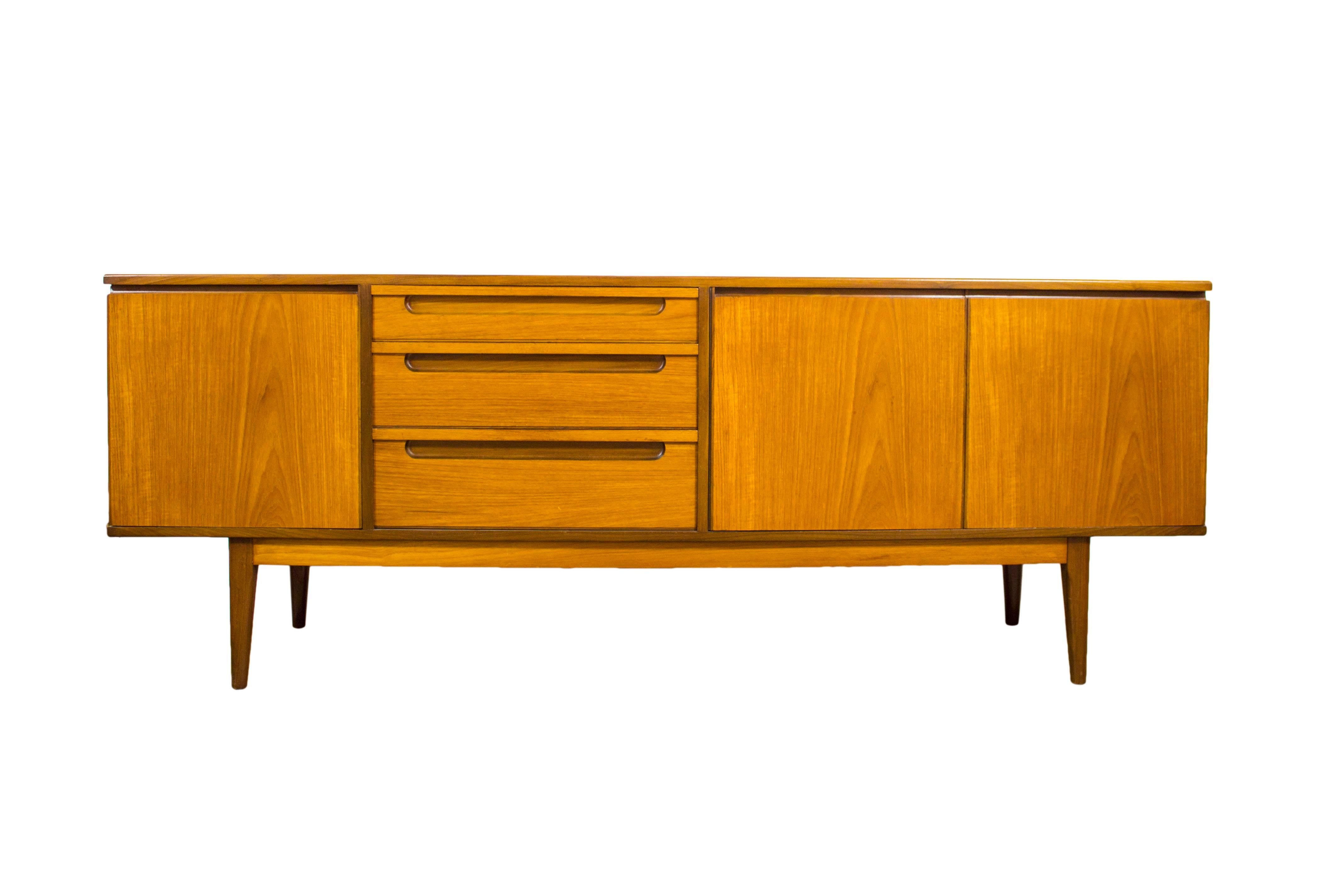 Founded in 1956, Alfred Cox (Furniture) Ltd swiftly became a household name with their high quality and stylish designs sold exclusively through Heals of London. Using the most exquisite of woods in their furniture, Alfred Cox established themselves