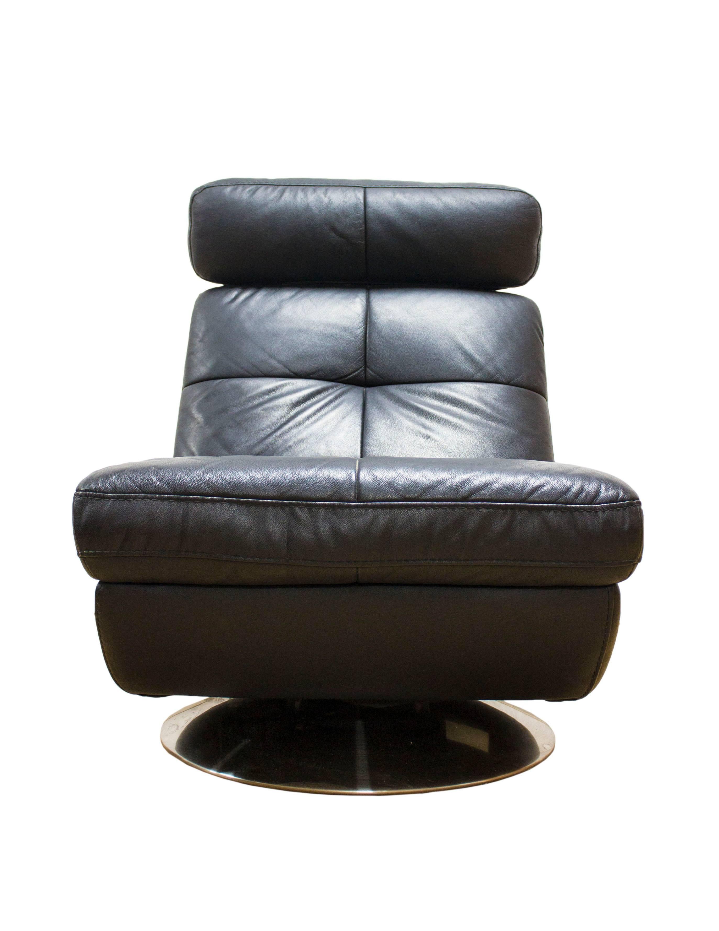 The Mid-Century designers experimented widely with differing styles and shapes taking advantage of exciting new materials and techniques to create ever more challenging and exciting designs.

This beautiful chair in soft black leather features an