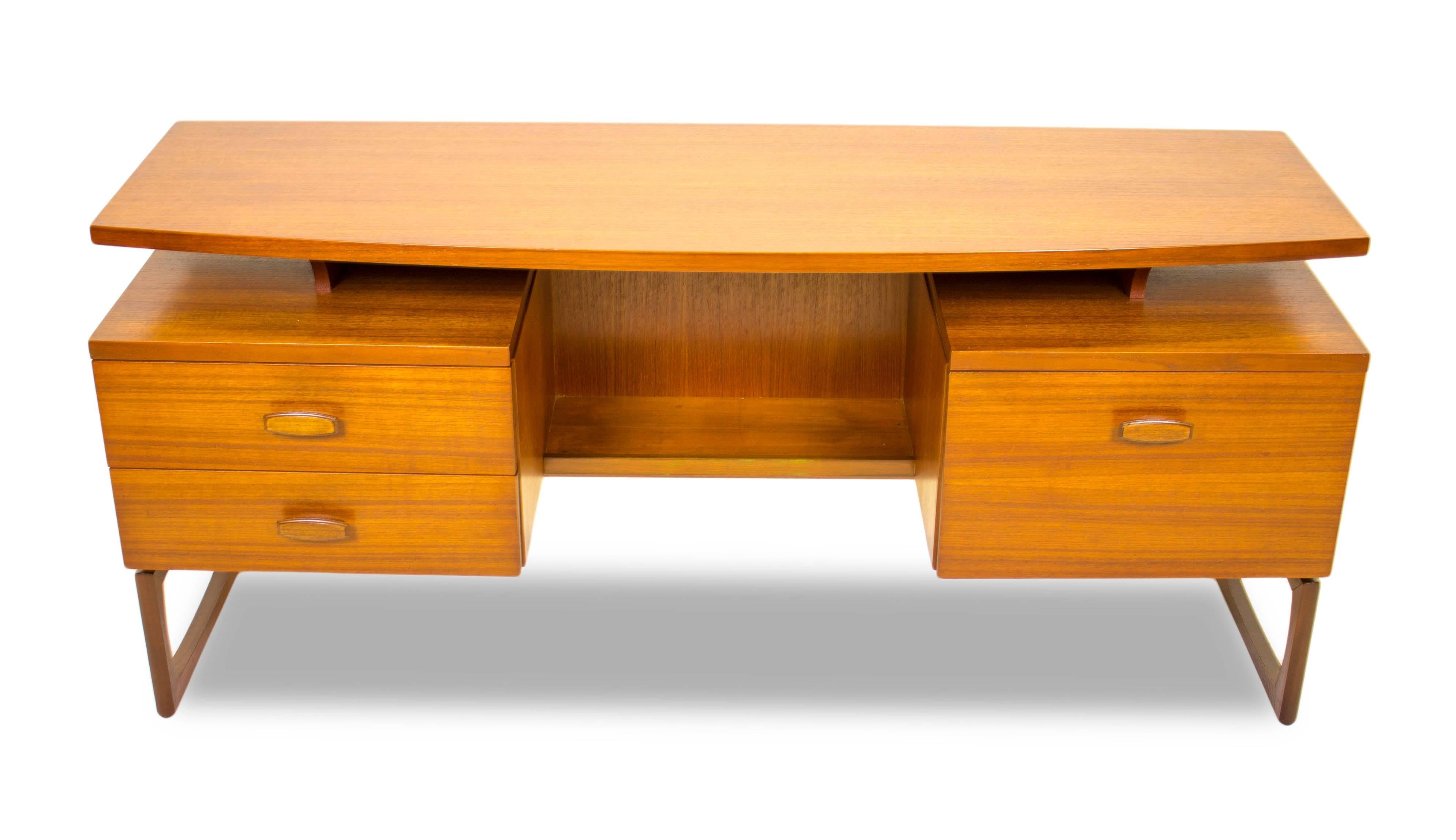 1965 could be argued as one of the best years for G Plan design with R Bennett creating the stunning Quadrille range of furniture in luxurious teak with beautiful rosewood handles.

An elegant and striking design, this desk is a stunning Danish