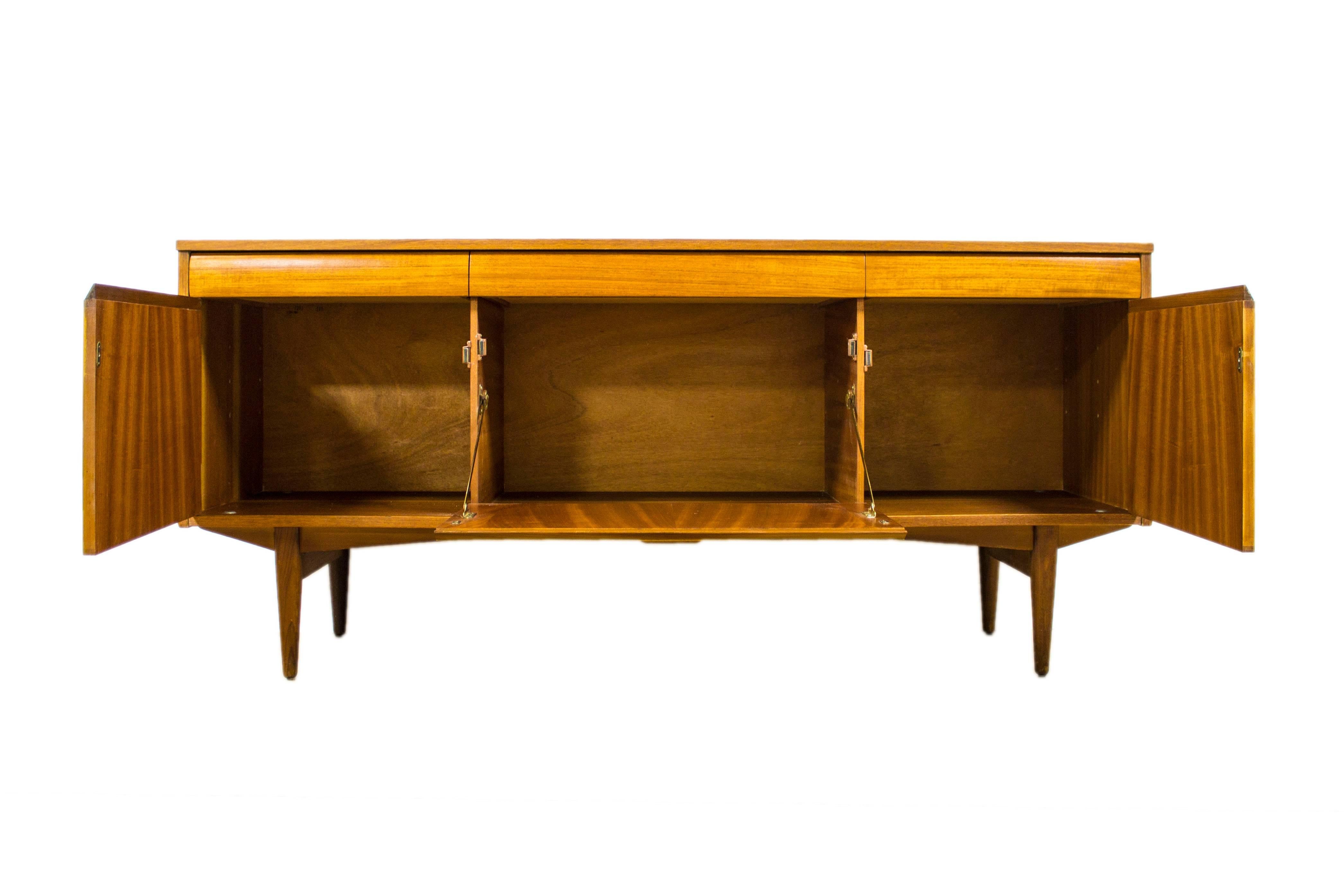 Greaves & Thomas are renowned for their innovative and stunning designs and this teak sideboard with its intricate inset pulls is a wonderful example of how they brought exotic materials together to create stylish and highly practical