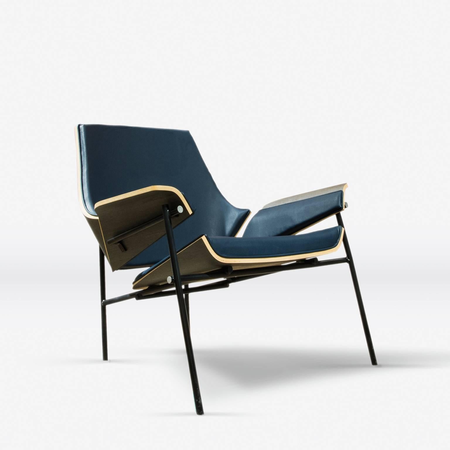 This lounge chair draws inspiration from the iconic “Red & Blue Chair,” from Gerrit Rietveld and mixing this with a wood bending technique developed by LEFT, Victor Aleman design, combines 3D modeling and Handmade wood shaping to create a modernist