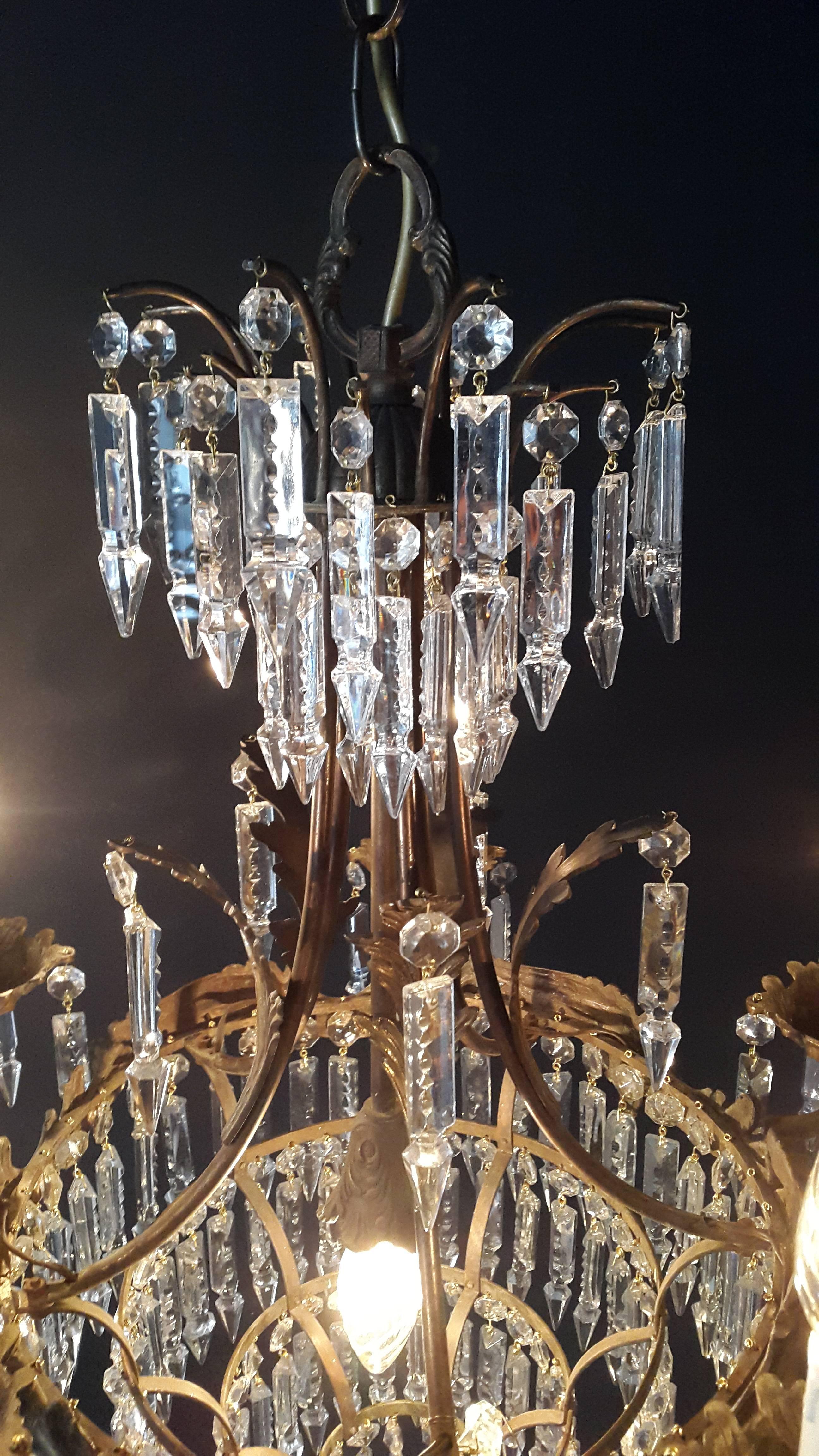 Measures: Total height: 90cm Height without chain: 70cm Diameter: 51cm Weight (approximately): 10kg

Number of lights: Six light bulb sockets: E14 Material: Brass

Crystal Chandelier Old Ceiling Lamp Brass Lustre Lights, 1940s Lamp Antique
Total