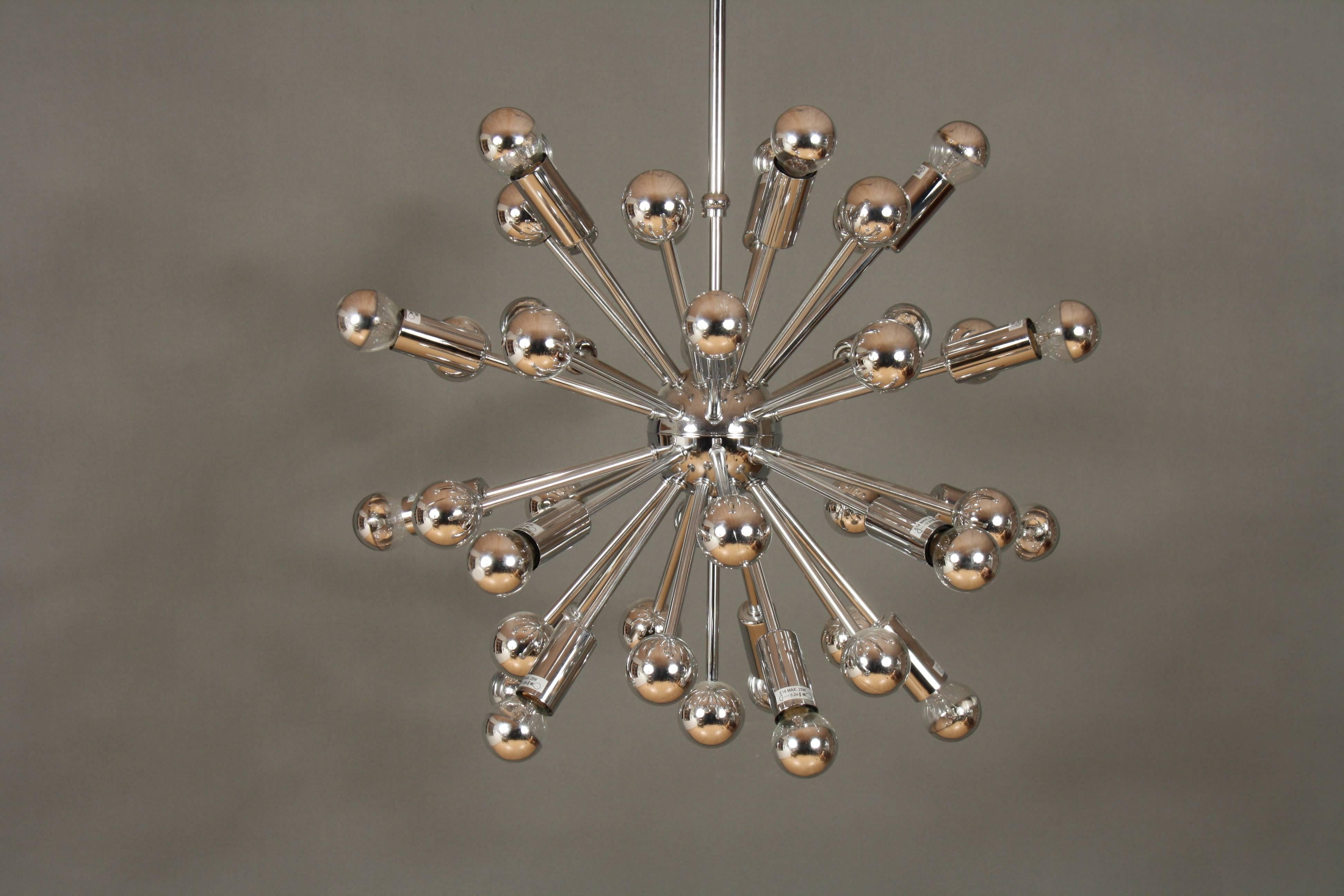Mid-Century style chrome Sputnik chandelier. Mid-Century Modern style Sputnik chandelier consisting of chrome rods that extends from its chromed steel centre point with 20 chrome balls and 20 light sockets.