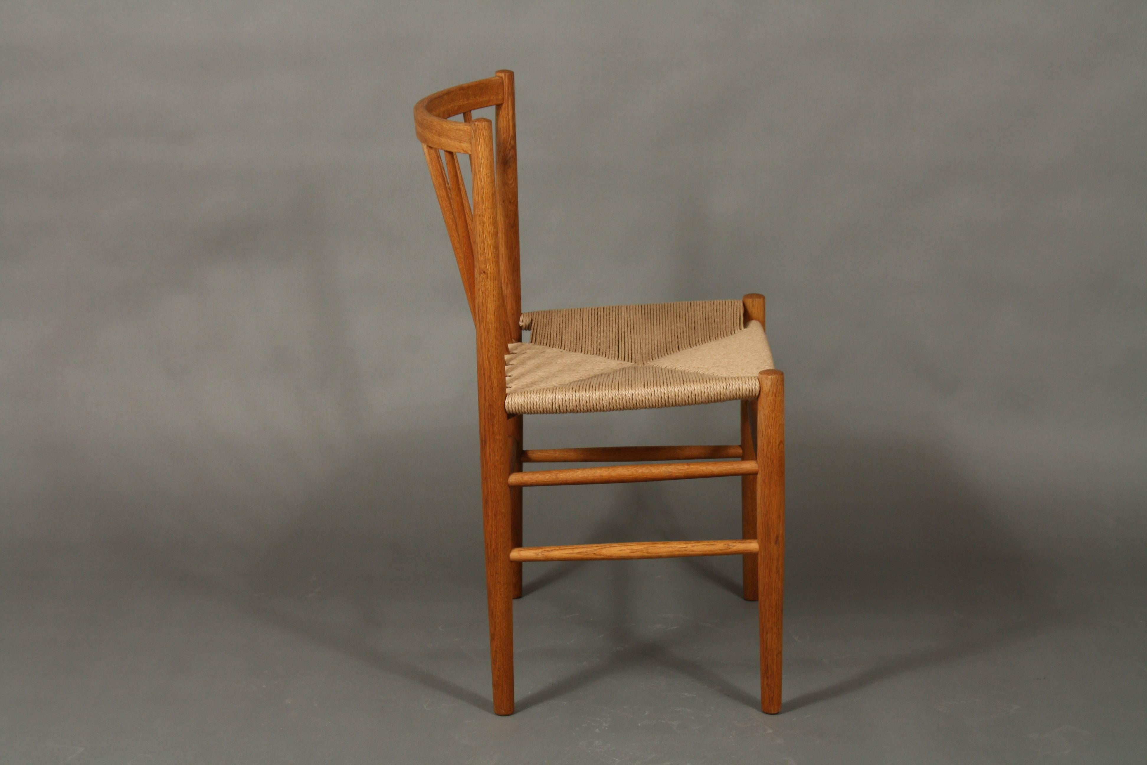 Mid-Century Jørgen Bækmark dining chairs, model J80 in oak and paper cord. The chairs are restored with new seats in paper cord. The model was designed in the 1950s and is very comfortable.