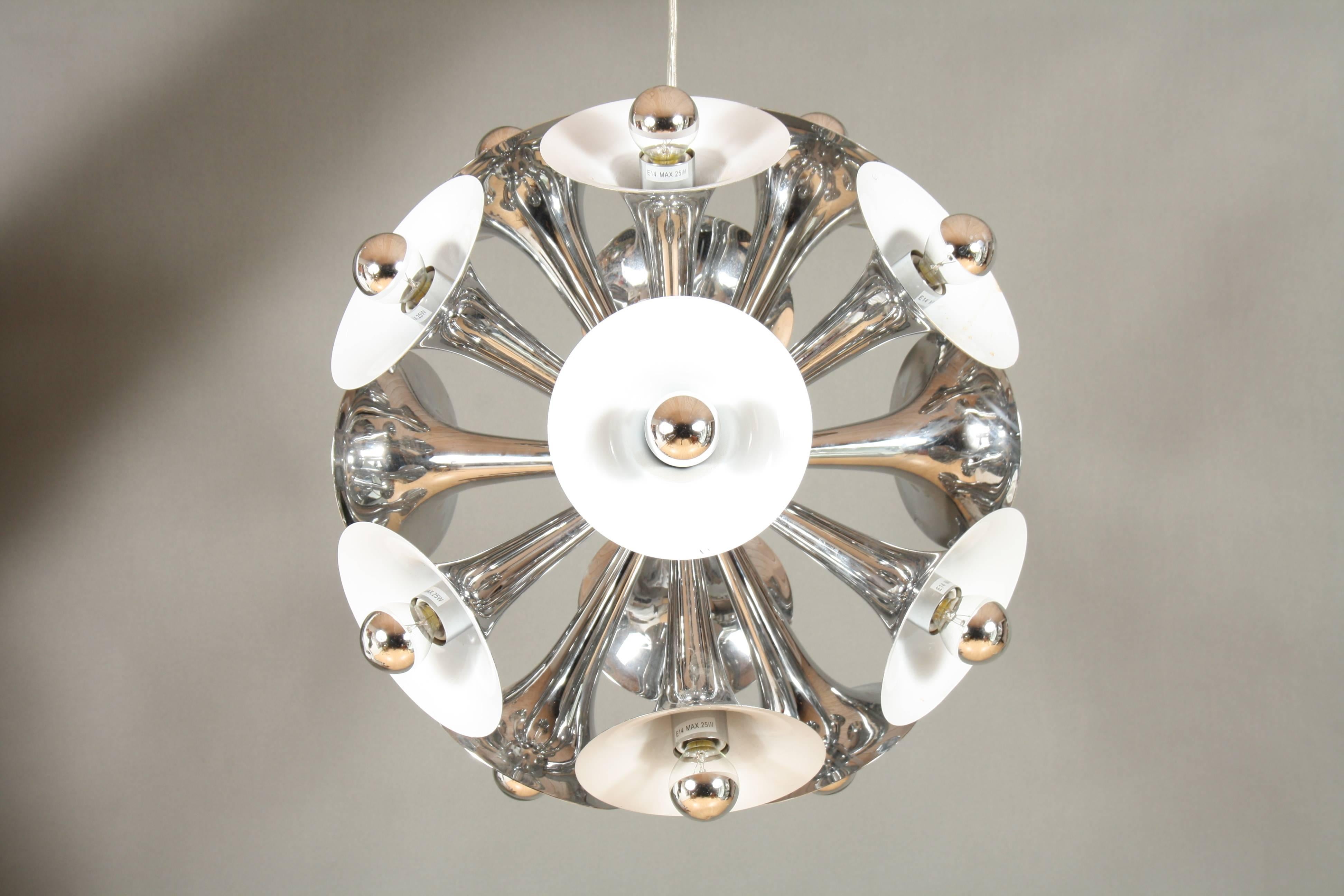 Very nice chrome Sputnik trumpet chandelier.
From the centre globe 15 trumpet-shaped shades stretch out creating a perfect sphere.
One of the upper trumpets has a small spot, but it's not visible.