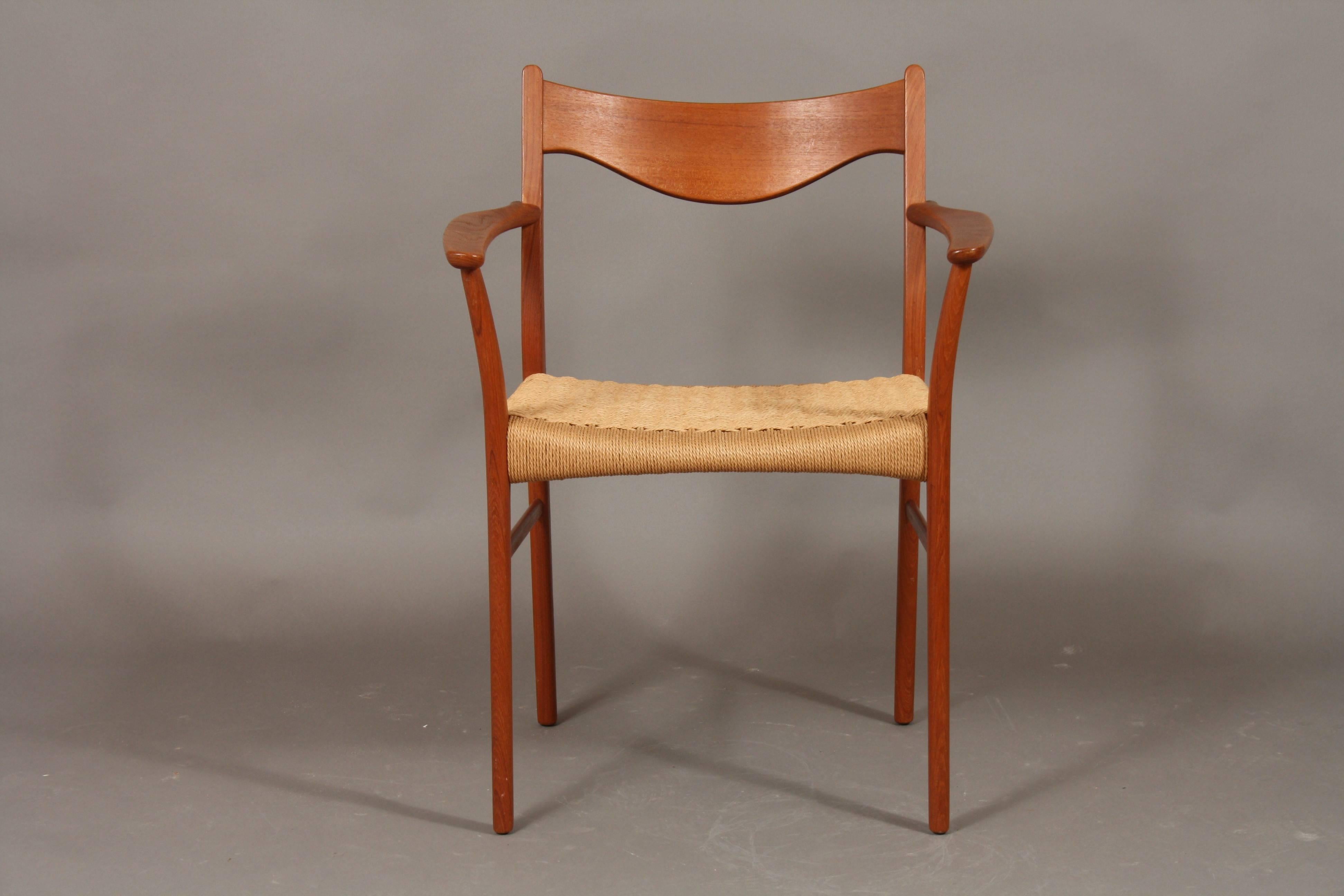 Set of two armchairs by the Danish designer Arne Wahl Iversen - model GS600. The frame is made of teak and the seat is woven seagrass and in very good condition. Beautiful Danish design from the Mid-Century. They are produced at Glyngøre Stolefabrik.